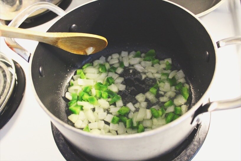 We start with sautéing finely diced white onions and green peppers.  بنبلش بتحريك البصل والفليفلة الخضرا
