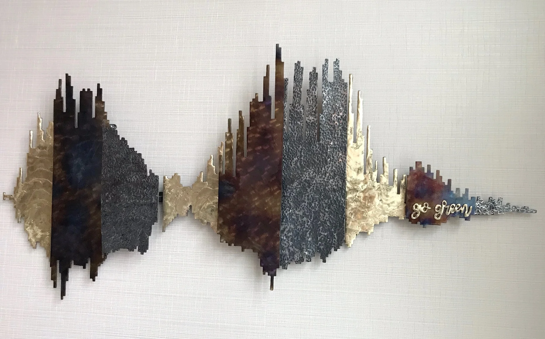 "go green soundwave" local metal artwork