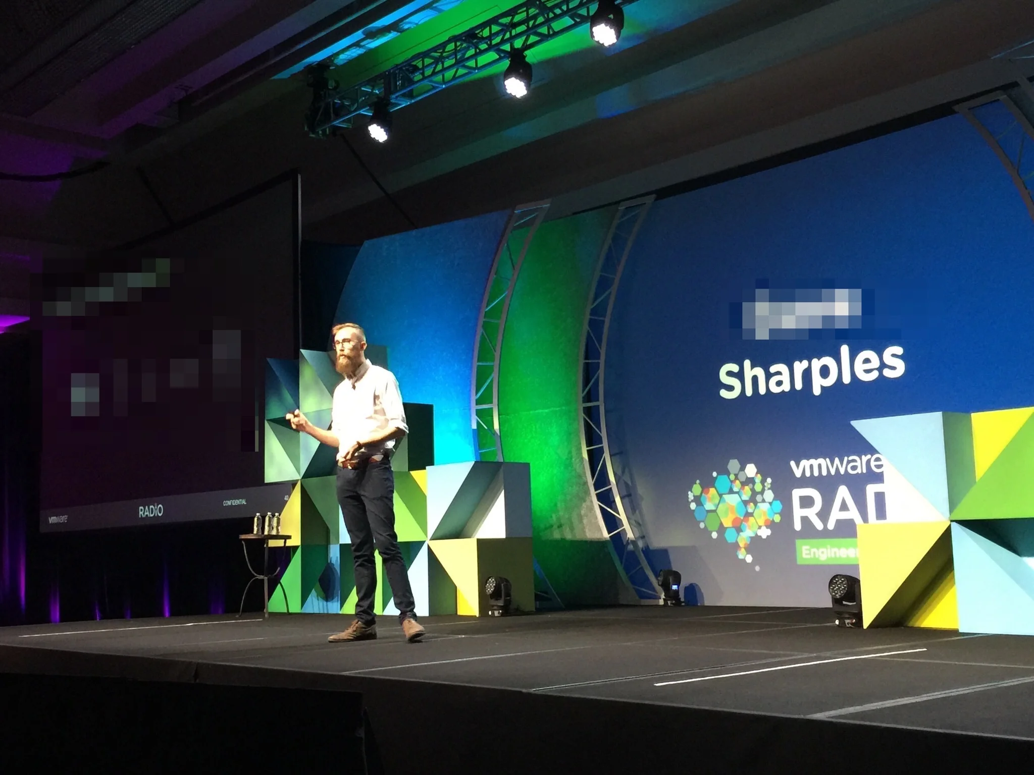 A (pre-transition) photo of me giving a talk about my research project at VMware's R&D conference!