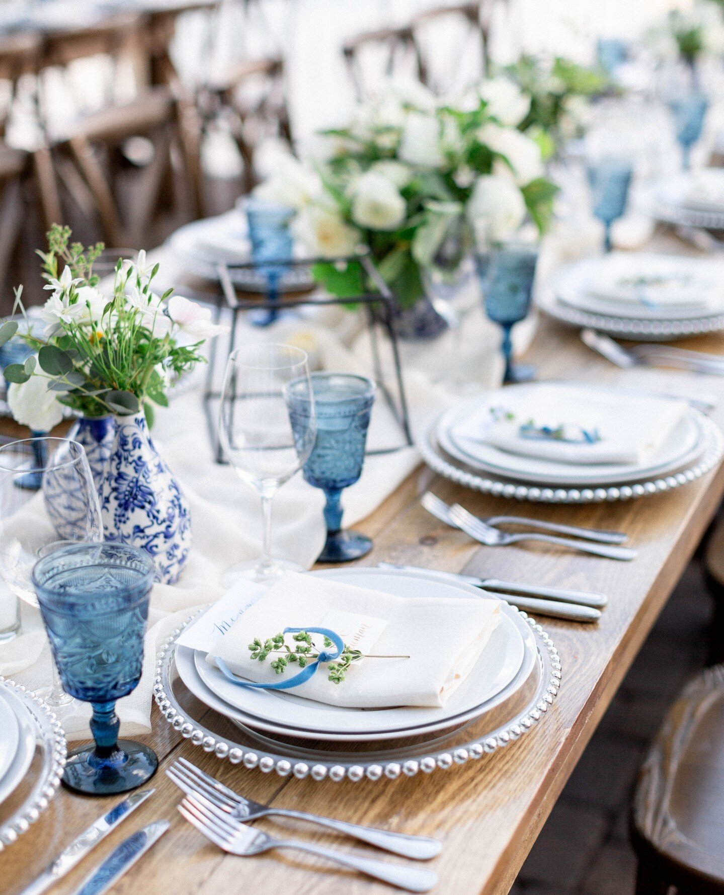 We can't help but swoon over the mesmerizing pops of blue that bring this tablescape to life. Every detail is perfectly executed, and we're thrilled to share it with you. Stay tuned for more stunning wedding inspiration from our talented team! 💙✨
