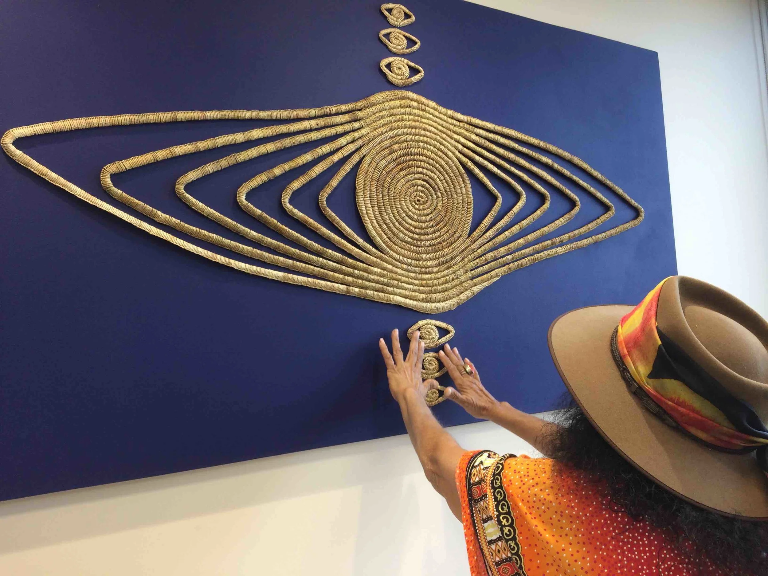 Betty Sumner adjusts her work 'The All Seeing Eye'. Photo Carl Kuddell, April 2017