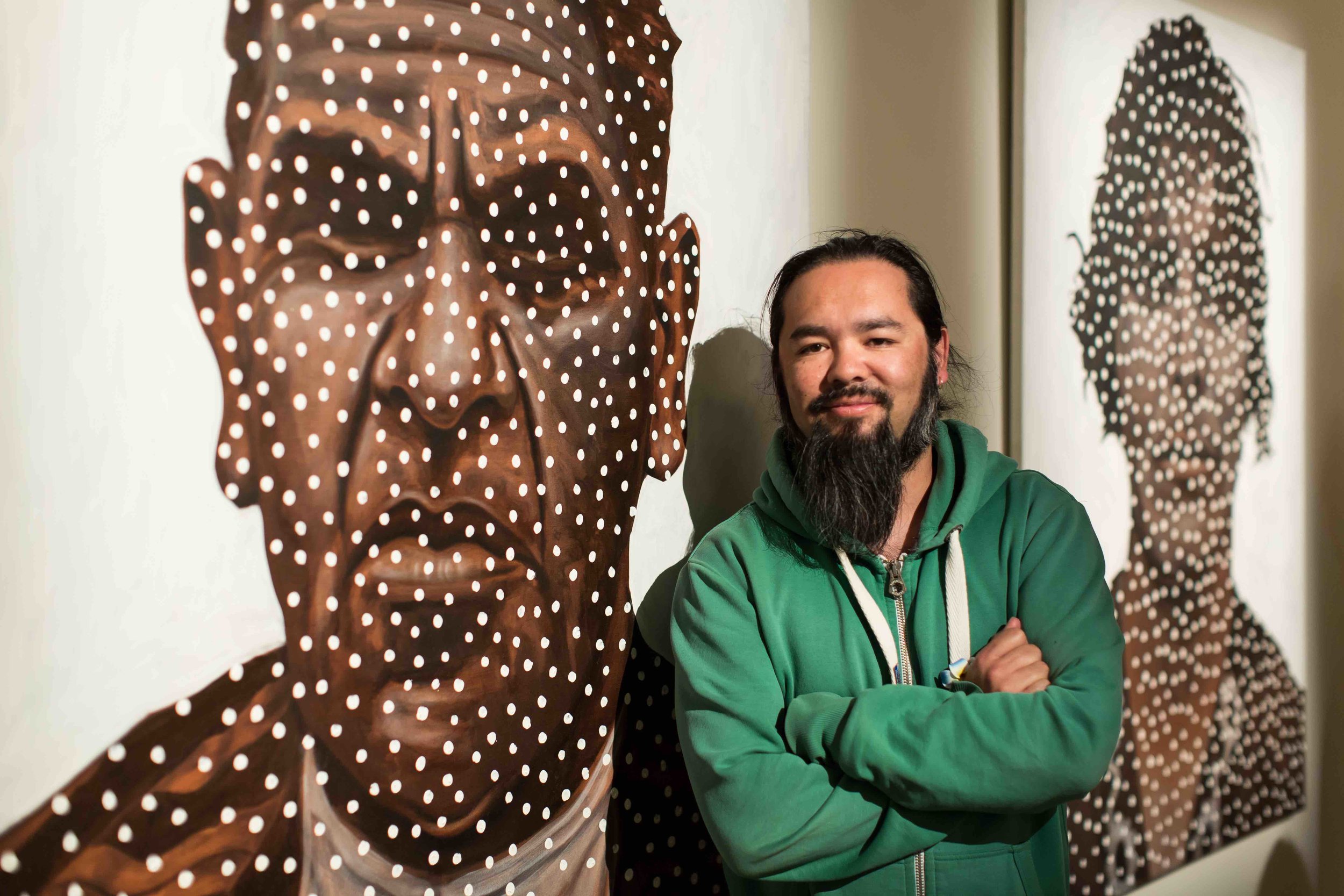 Damien Shen in front of his new work, Great-Grandparents, at the Murray Bridge Regional Gallery. Photo: Johanis Lyons-Reid/ Change Media