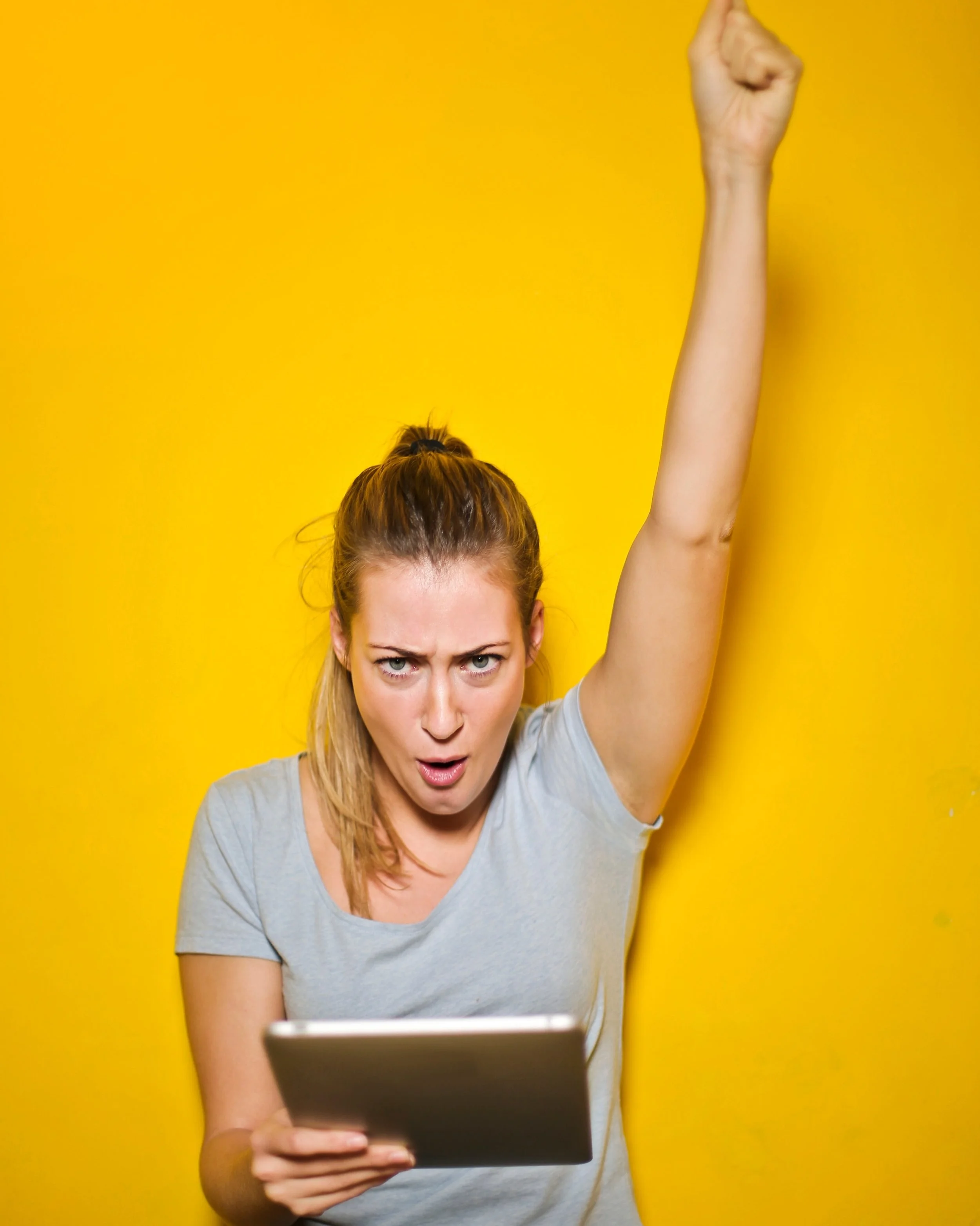 Canva+-+Photo+of+a+Woman+Holding+an+Ipad.jpg