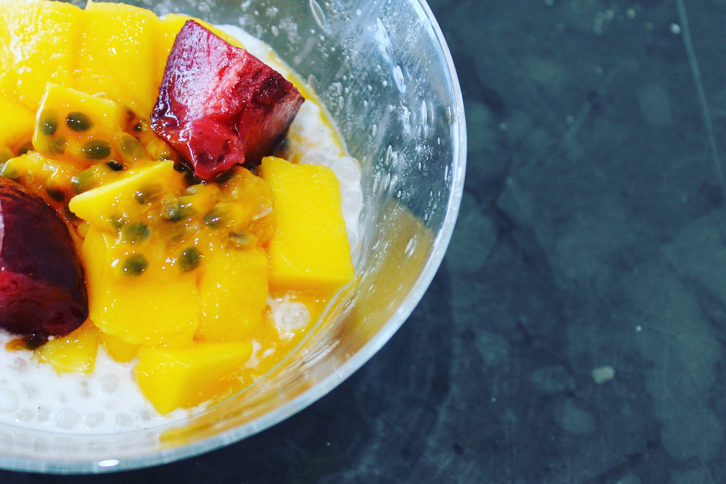 Coconut jelly with sago, mango, passion fruit and plums