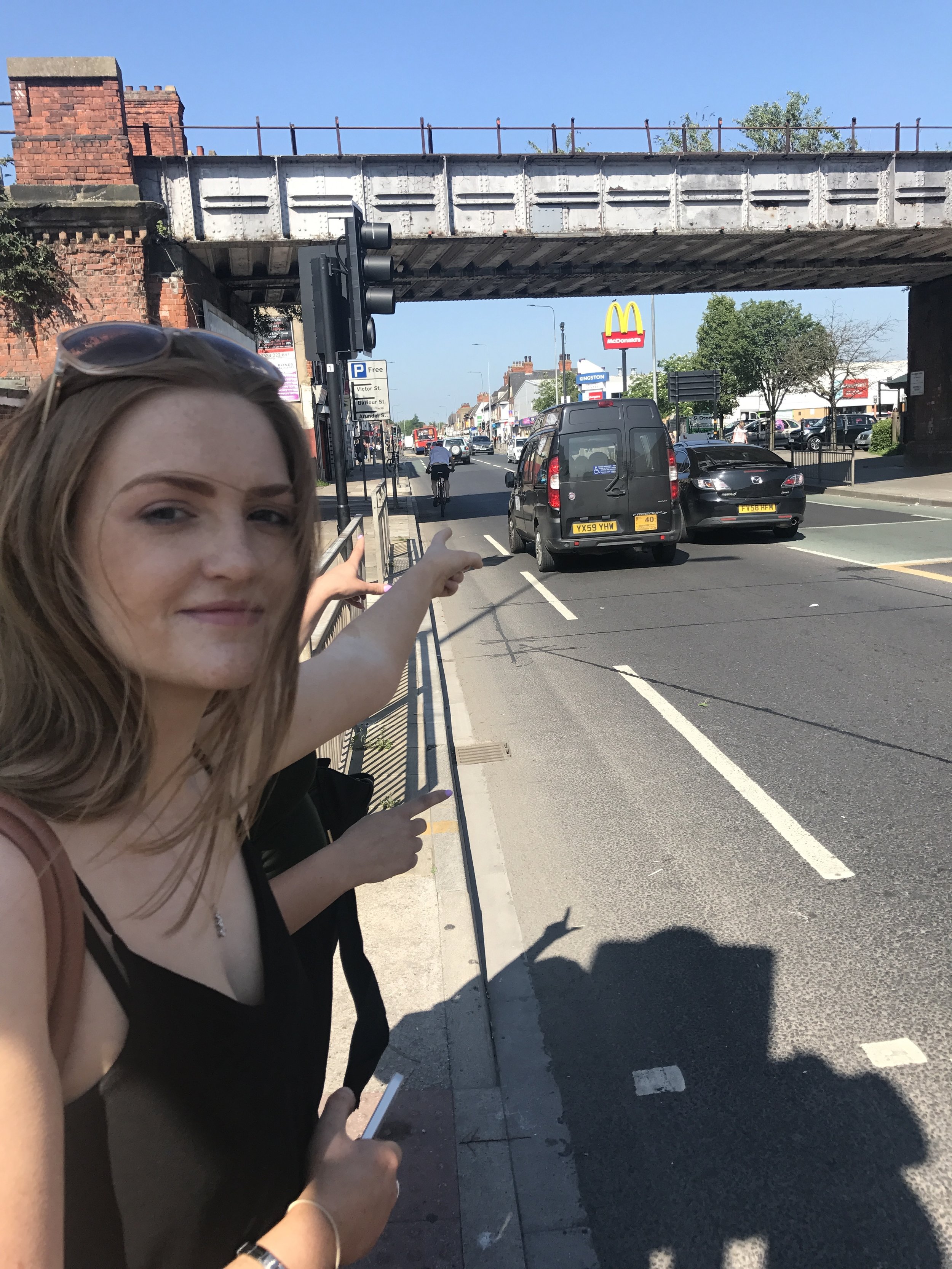 Melissa pointing at our broken taxi 