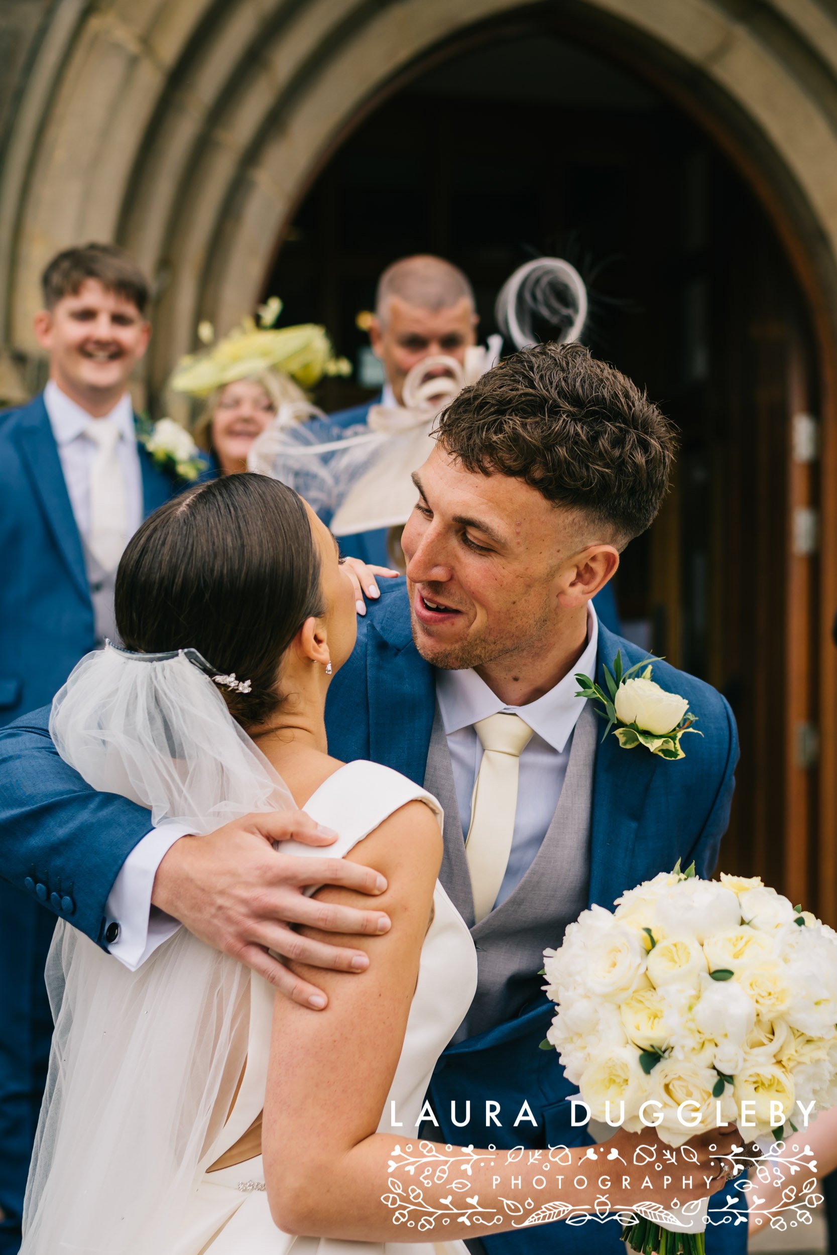 bride being congratulated by guest at lancashire wedding