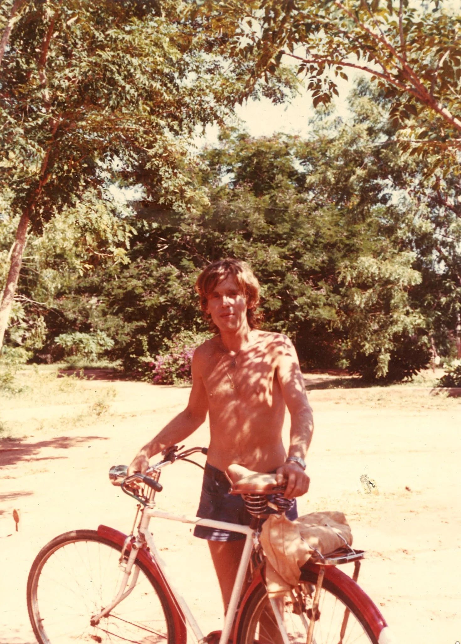 Igor WITH HIS RED-WHITE CYCLE in Auroville-Aspiration jpg.jpg