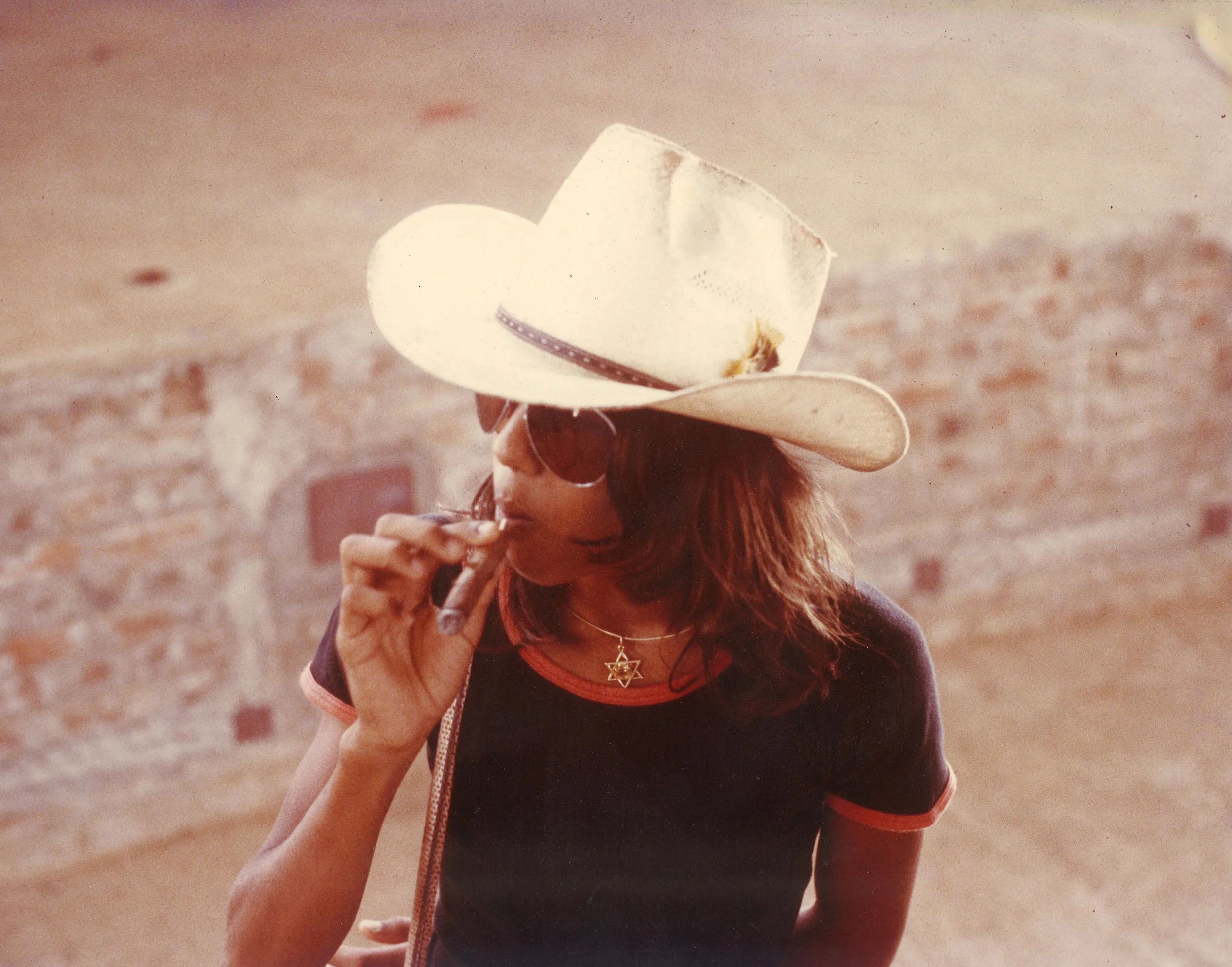 Taddy boy with white cow-boy hat and cigar