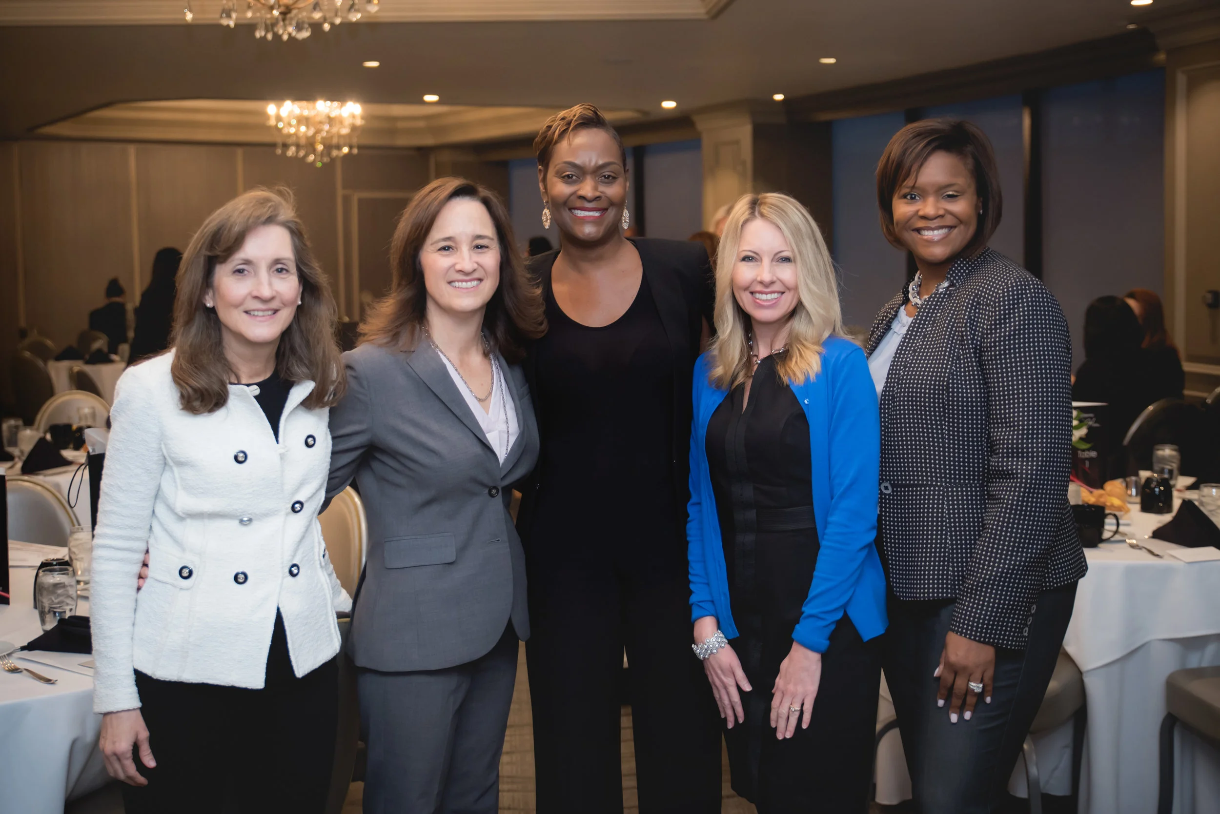 Dr. Tammy Wong, CEO of Fostering Executive Leadership in Irvine, Lisa Haines, Vice President of Communications and Public Affairs for Disneyland Resort in Anaheim, Leadership in Heels Founder and CEO Scharrell Jackson, Lori Seal, CEO of Blytheco in Laguna Hills, and Lanän Clark, Vice President and Associate Market Manager of Merrill Lynch in Newport Beach, pose for a photo at Leadership in Heels “Journey to the Top: The Juggling Act” on Thursday, March 21, 2019 at the Center Club in Costa Mesa. They were featured on the event panel. / Photo by Kait McKay Photography