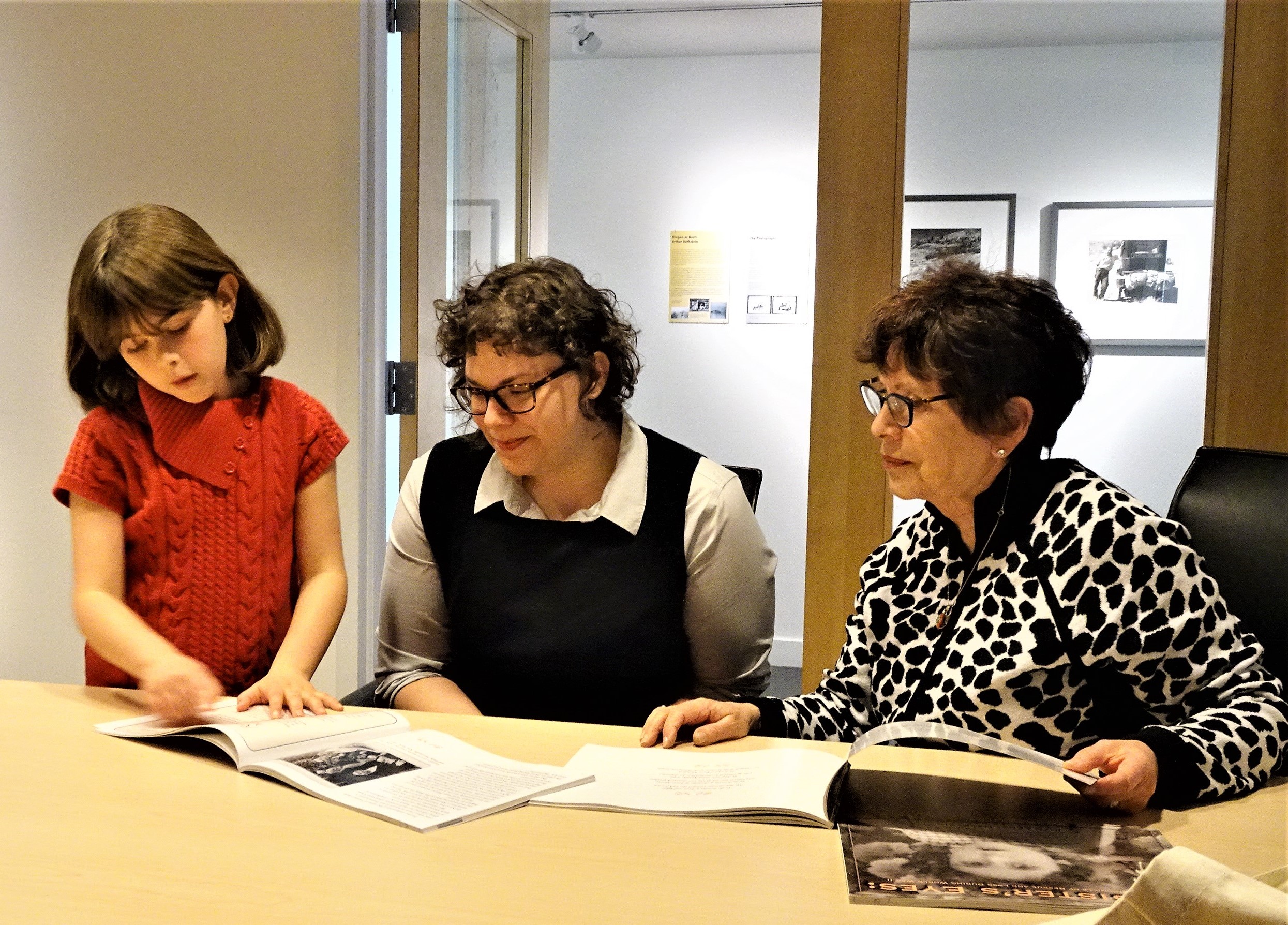 Here she is presenting copies of My Sister's Eyes to April Slabosheski (center), Director of Education at OJMCHE. Her grandmother and author of the book, Joan Arnay Halperin, looks on with pride. OJMCHE makes Holocaust Educational Trunks available to middle and high school teachers for use in their classrooms to study Holocaust Rescuers among other subjects. 