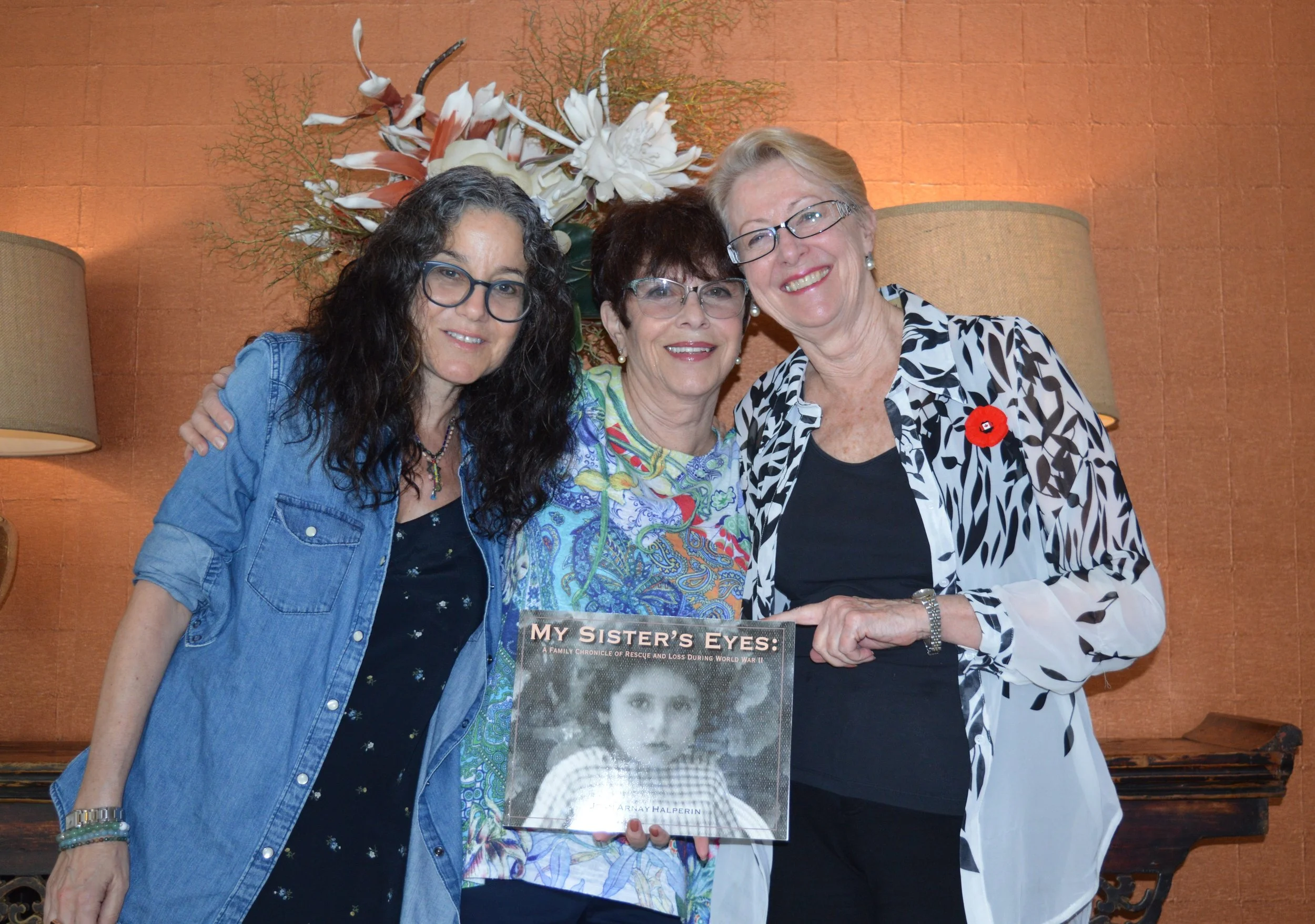 L to R: Amy, Joan and Margaret with Joan’s book My Sister’s Eyes, a tribute to Joan’s sister Yvonne (pictured on the cover).