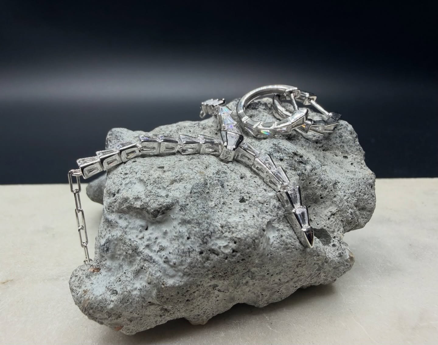 &bull; Elevate your everyday shine with the BKB Crystal Edge Set, featuring a matching 925 silver necklace and hoop earrings crafted with precision-cut cubic stones. This sleek, modern design delivers clean lines, crisp sparkle, and a bold edge that 