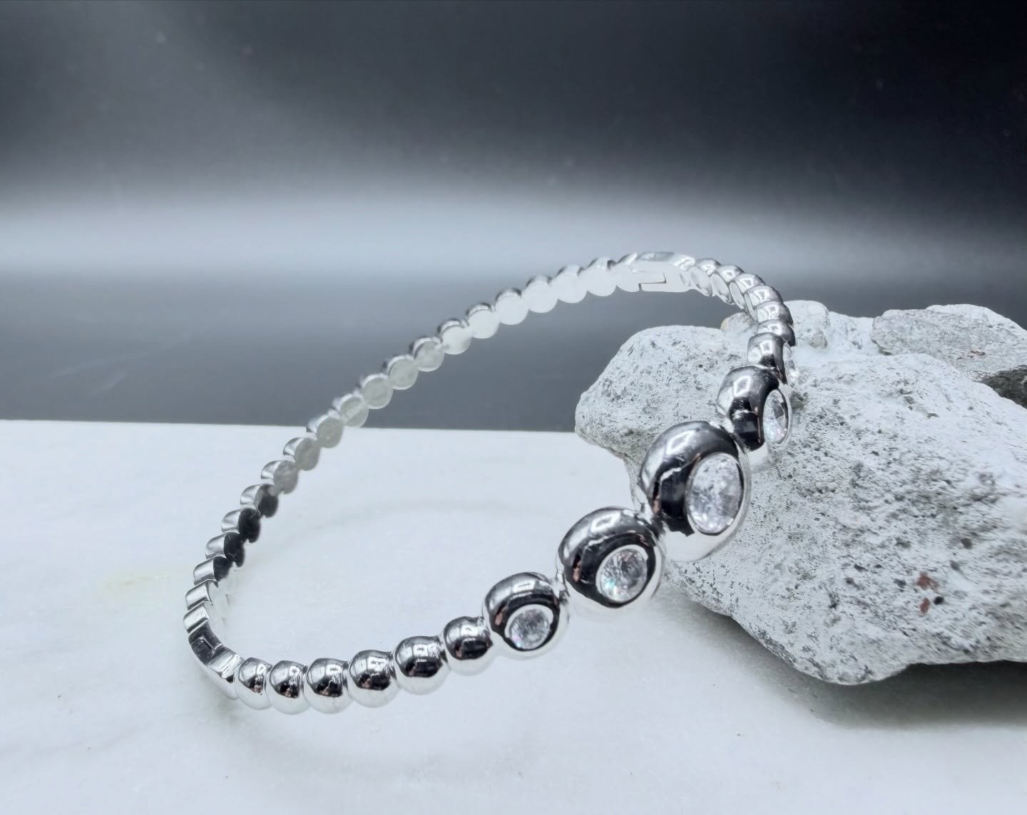 Meet the BKB Luxe Orbit Bracelet &mdash; where modern edge meets timeless elegance. Crafted from high-grade stainless steel and finished with brilliant cubic stones, this bracelet delivers a clean, polished glow designed to elevate any wrist stack. I