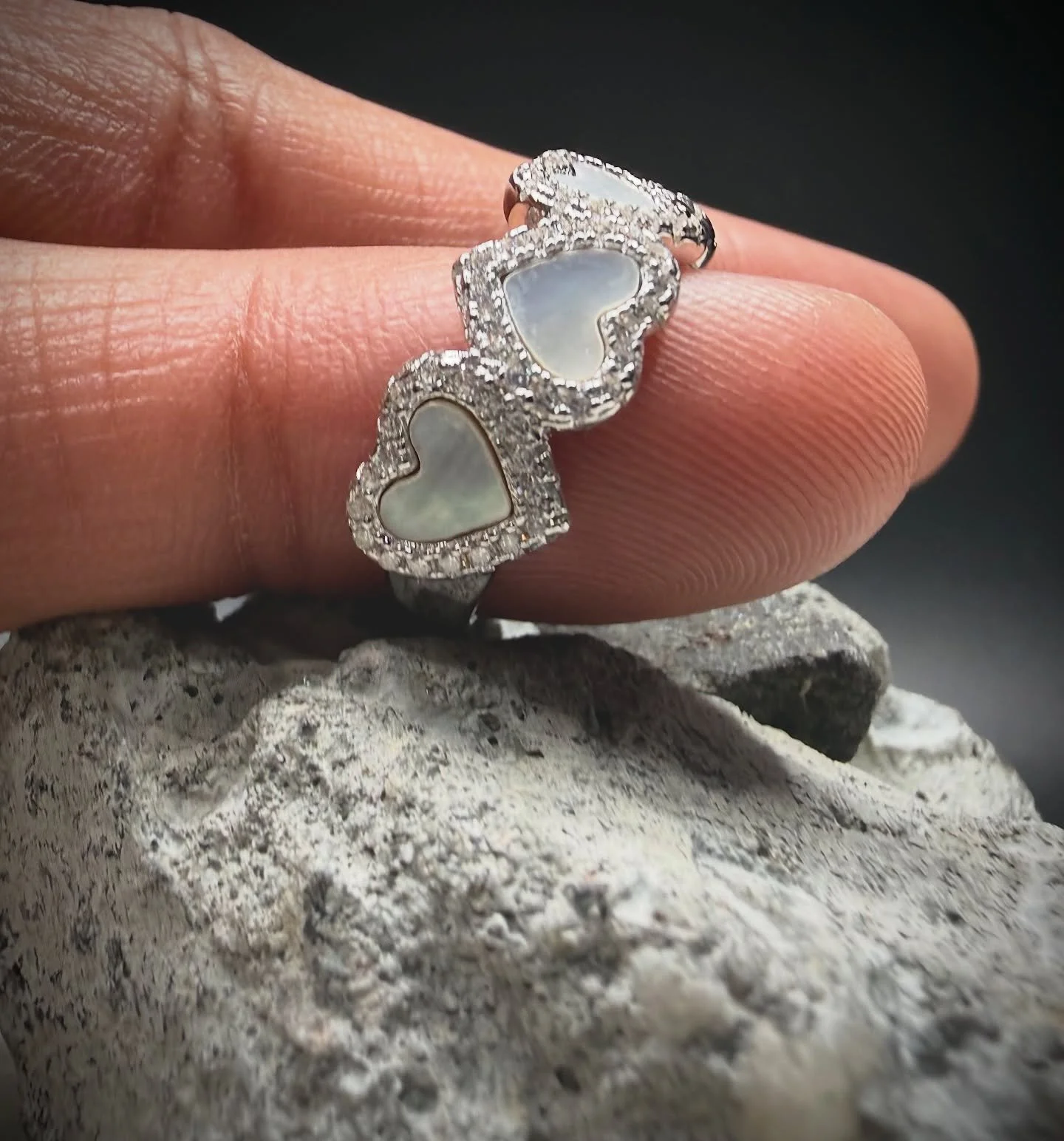 BKB TRIPLE HEART HALO RING.

- Crafted in premium 925 sterling silver, the Triple Heart Halo Ring features three softly contoured heart motifs, each framed with pav&eacute;-set cubic stones for balanced brilliance. -