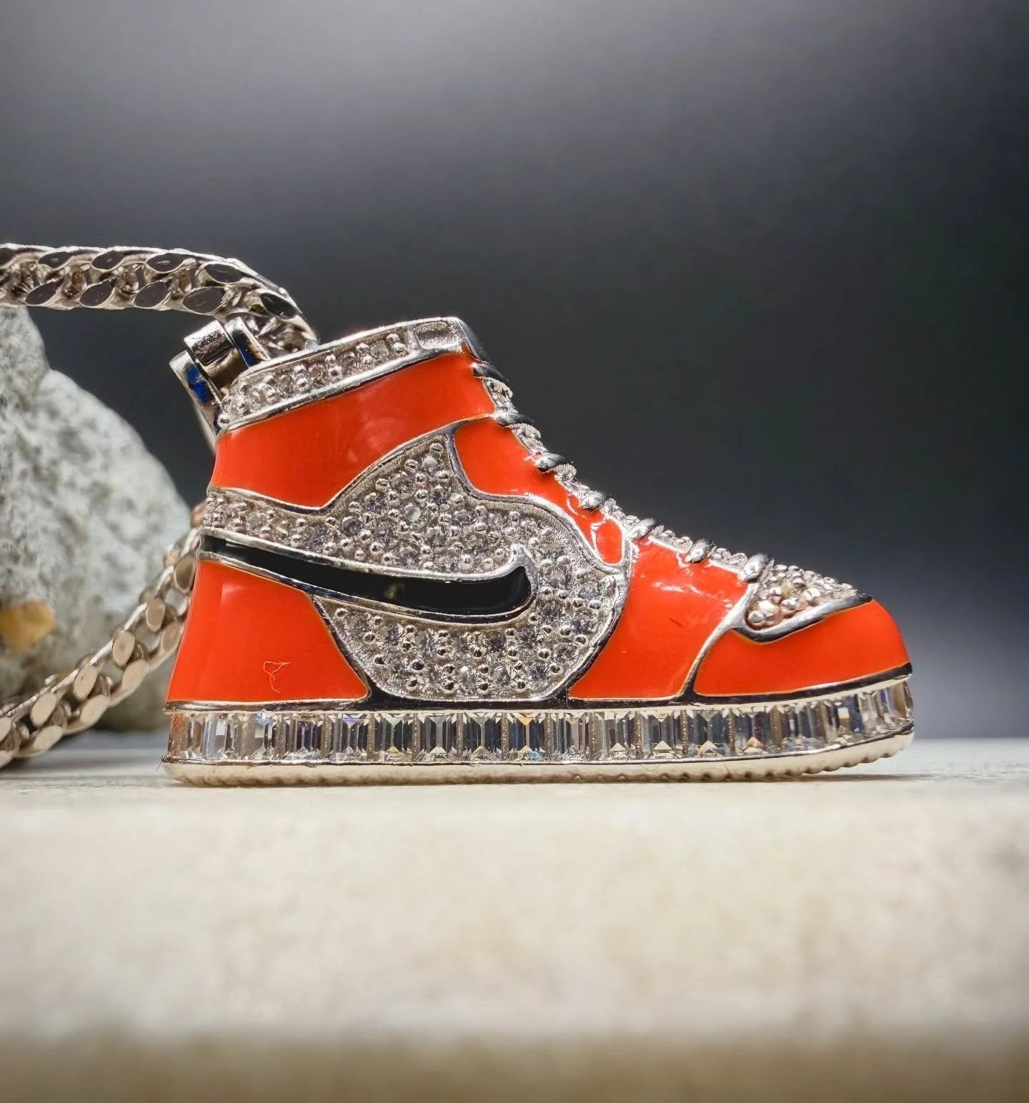 BKB ICON SNEAKER &bull; 

Designed with precision and shine, this statement piece blends street culture with elevated craftsmanship. The pendant hangs from a durable, polished silver Franco chain, offering a bold yet refined look !