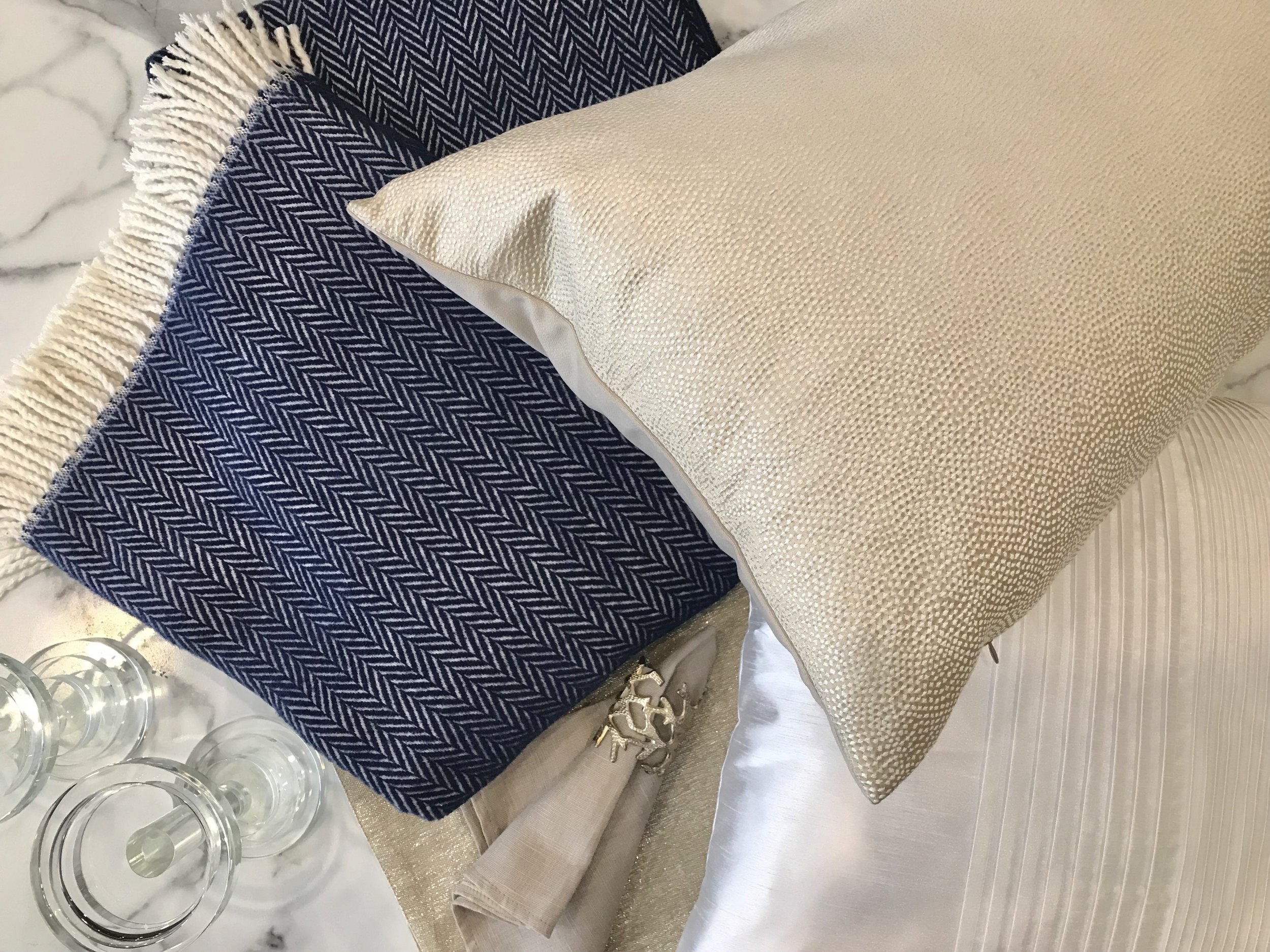 Crystal Candle Pillar (small) - $56.95 (medium) - $63.95, Blue Chevron Throw - $98.95, Gold Placemat - $23.95, Linen Napkin - $43.95, Silver Coral Napkin Ring - $14.95, Champagne Lumbar Pillow - $74.95, White Pleated Pillow - $48.95