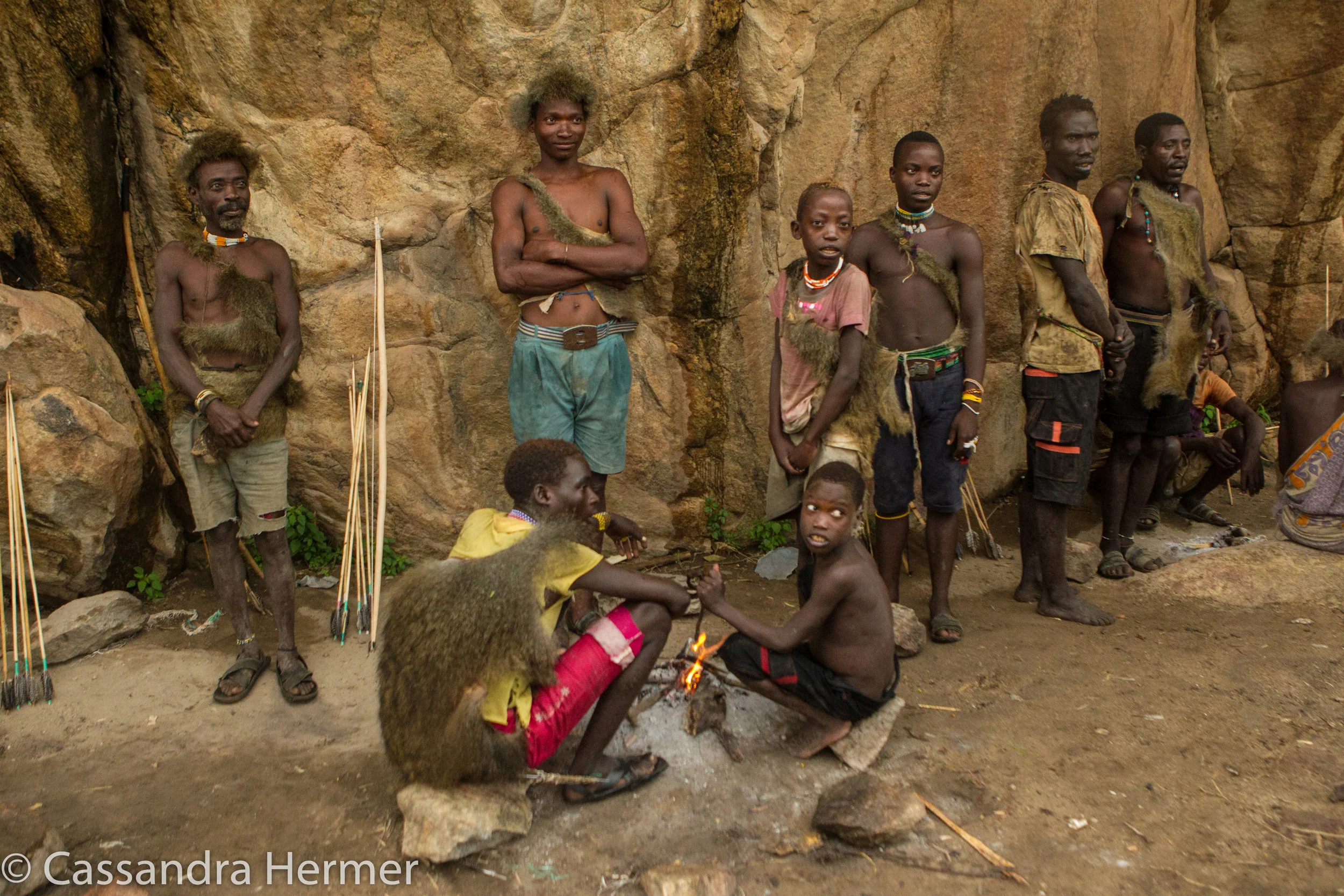  Hadazbe men cooking the three day old baboon for us. 