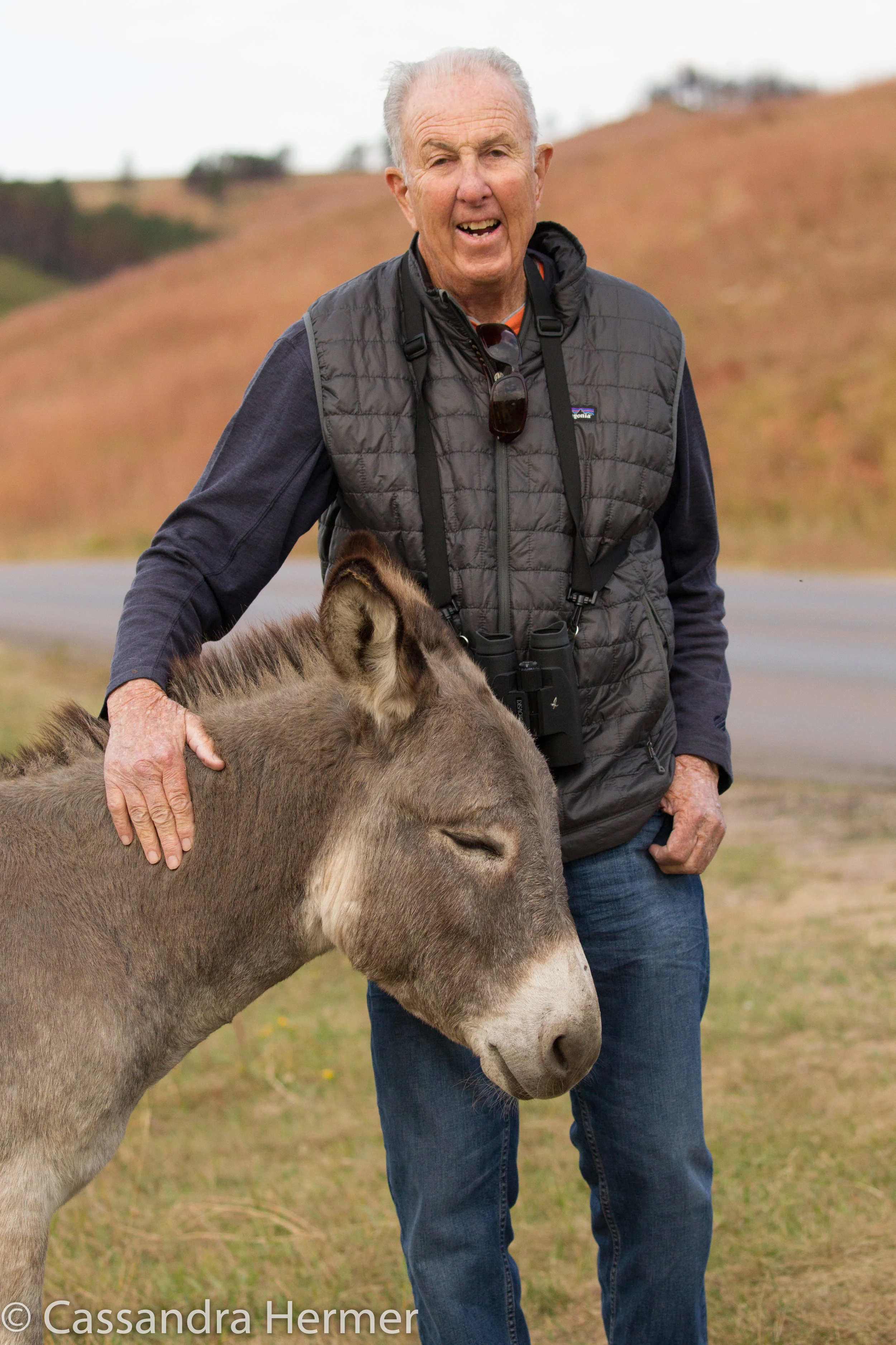  My hubby,Alan, with a wild donkey. Black Hills 