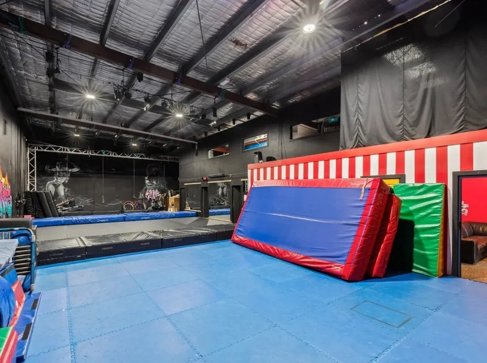 CircArts studio training floor with tumbling mats and air track
