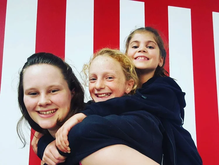 Kids smiling at a circus party