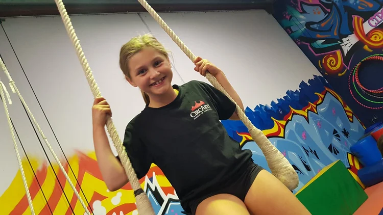 Child on a trapeze