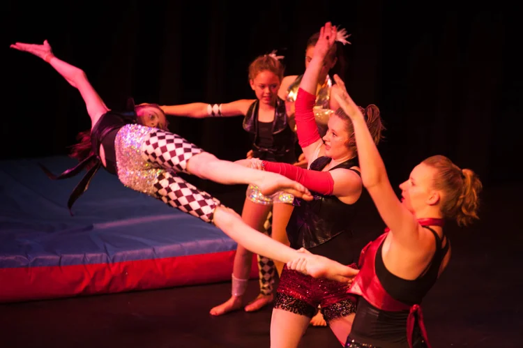 Kids doing group acrobatics