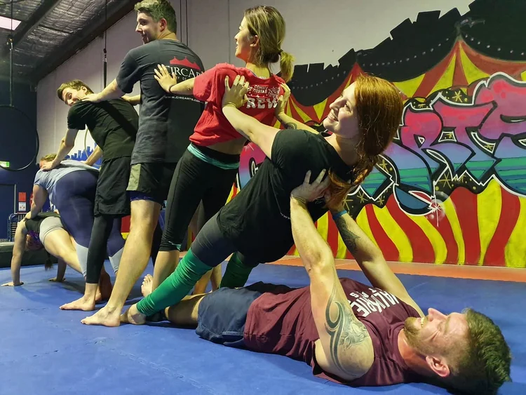 Guests trying partner acrobatics