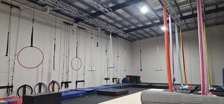 Aerial studio with silks, hoops and trapezes rigged