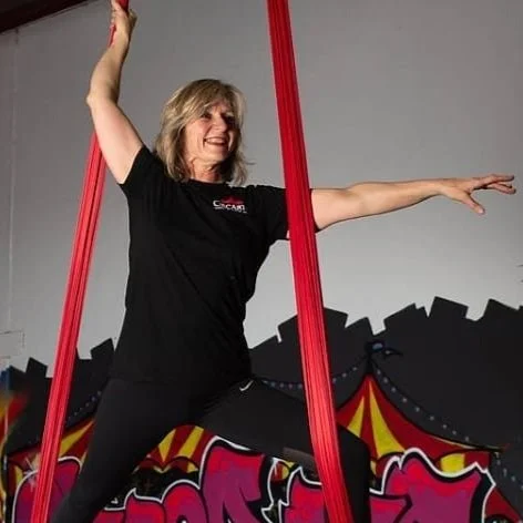 Guest posing on aerial silks