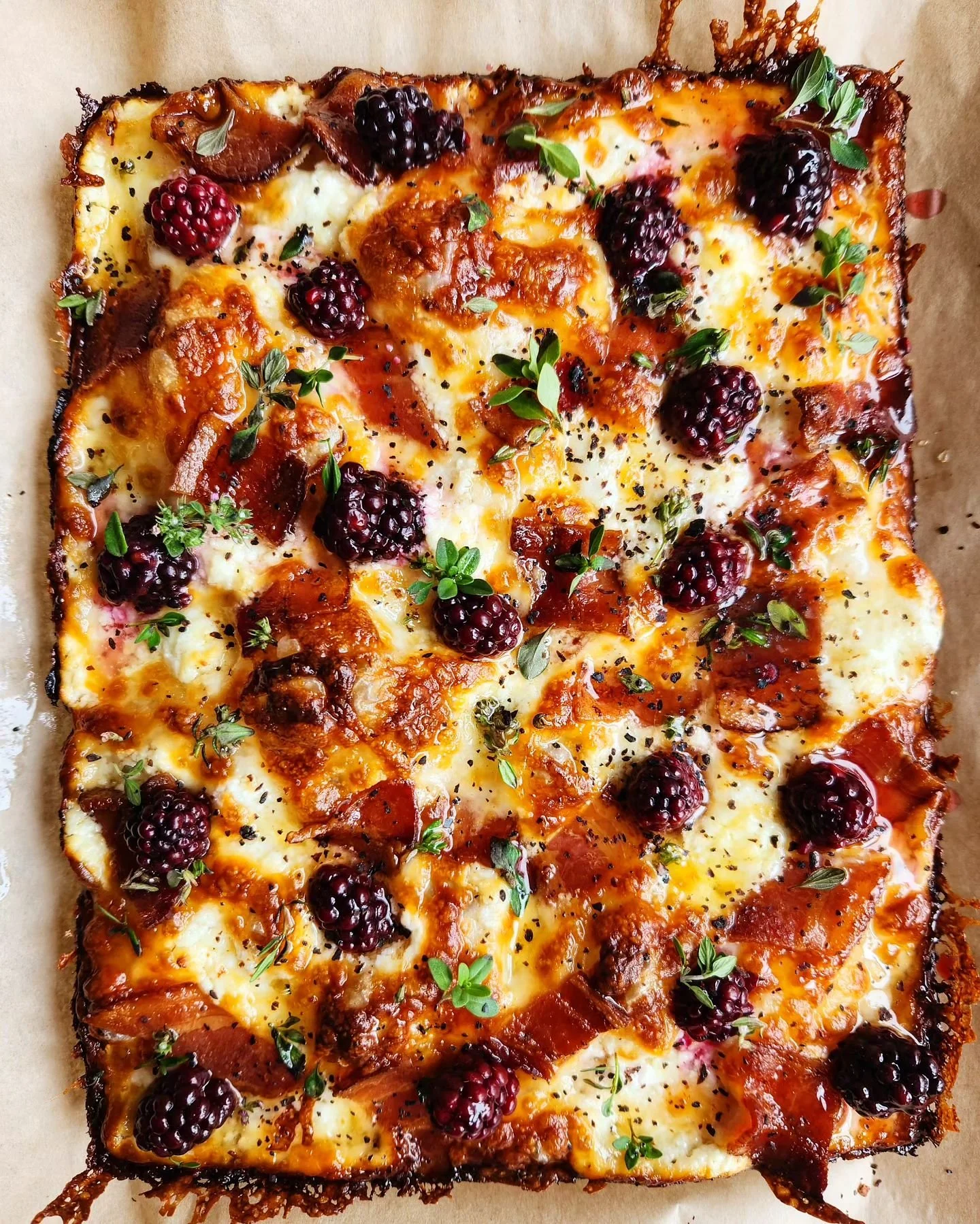 Hello there. We are back at it today. This week's feature has pickled blackberries, bacon, shallots, goat cheese, honey, brown butter, thyme, lemon thyme with urfa biber chili flakes.