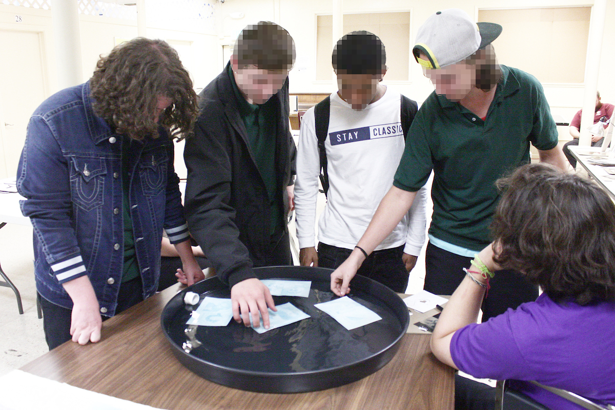 Boys developing personalized cyanotypes.jpg