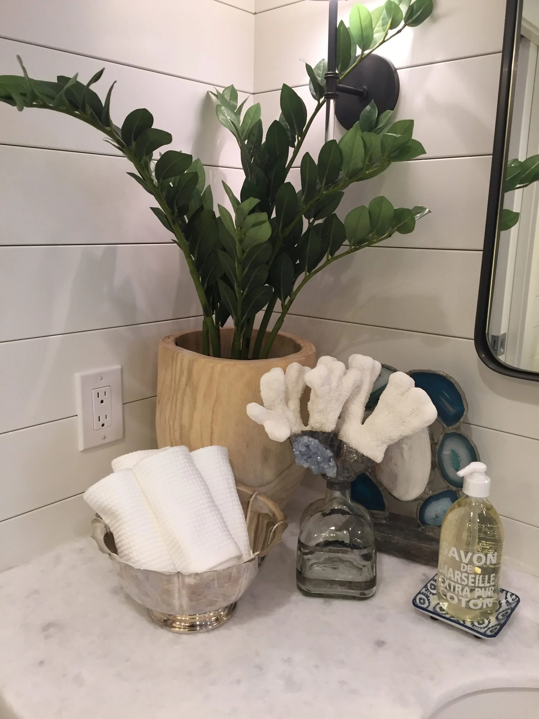 Corner of master bathroom counter. Crystal and stone accents