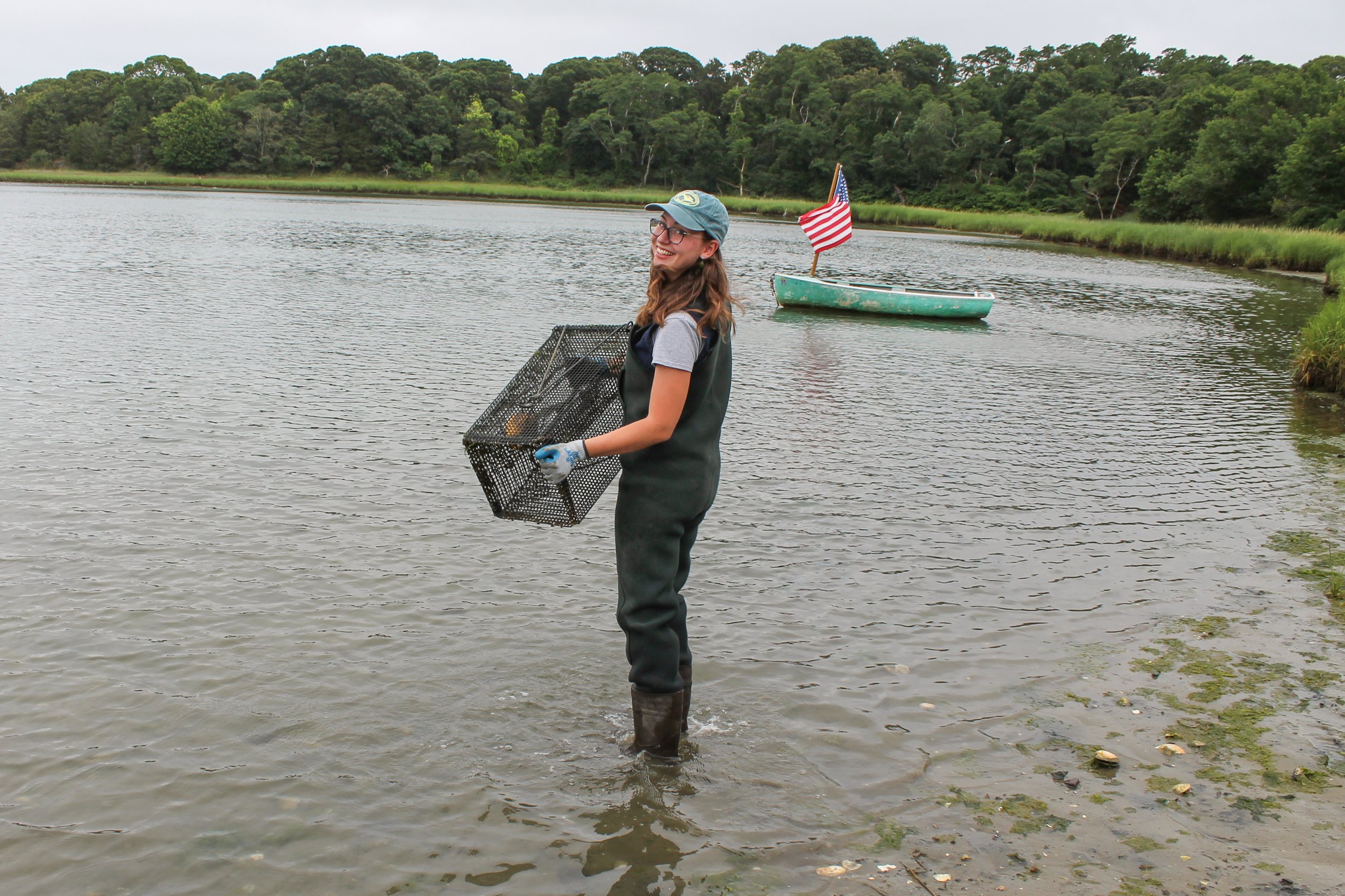 CCS Marine Fisheries Research Program Director Owen Nichols (left) and AmeriCorps Service Member Ella Wegfehrt at Eastham Salt Pond