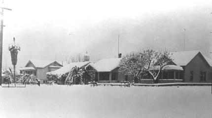 Patterson House (far right) in 1942 snow, future home of Grindstone Club 2005 to present