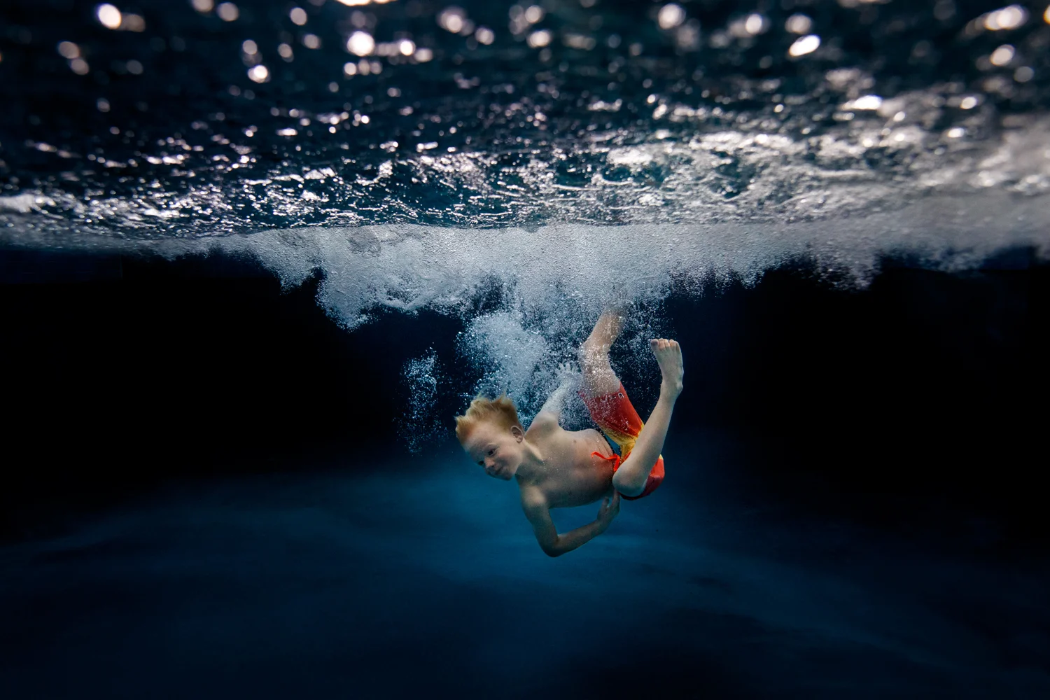 ArdelleNeubert_UnderwaterPhotography_Pool_Splash_Child_Blue_Jump.jpg