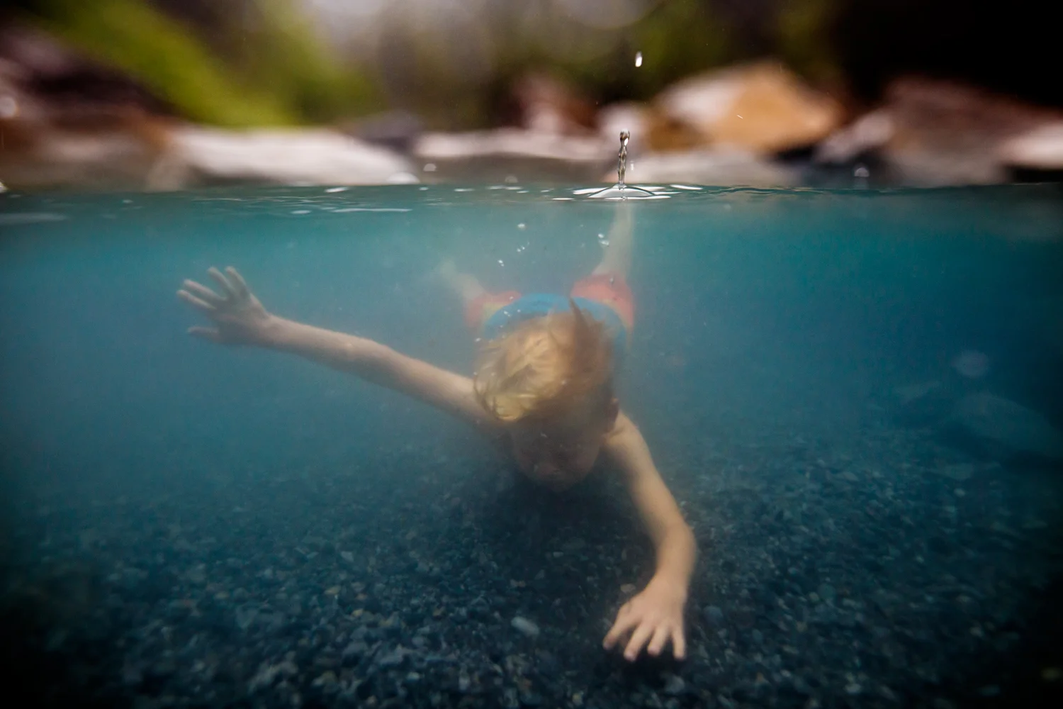 ArdelleNeubert_UnderwaterPhotography_WaterDroplet_Under_Float_HotSpring_rocks.jpg