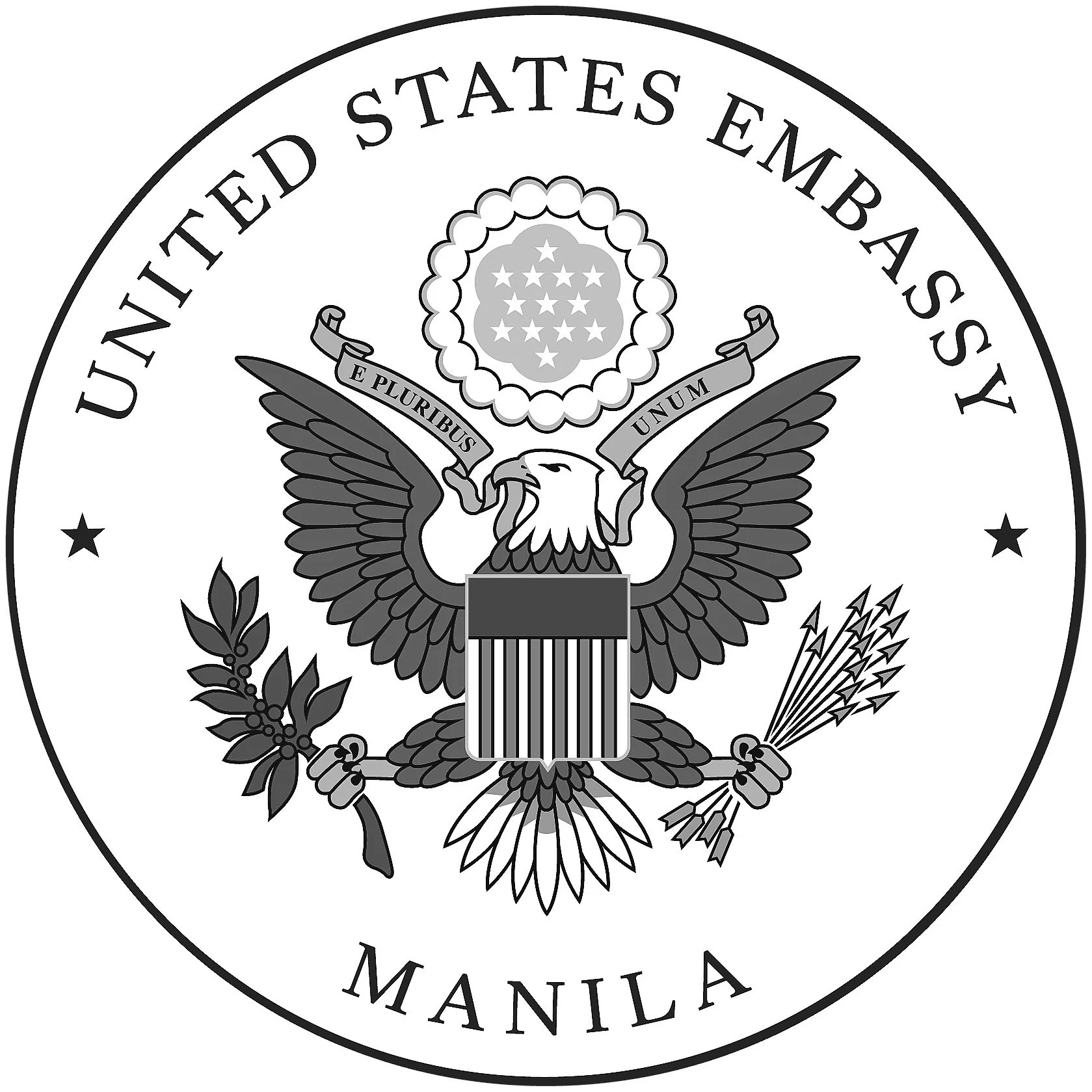 Seal of the United States Embassy in Manila, featuring an eagle holding an olive branch and arrows, with a shield on its chest, and a circle of stars above. The text surrounds the seal with 'United States Embassy' at the top and 'Manila' at the bottom.