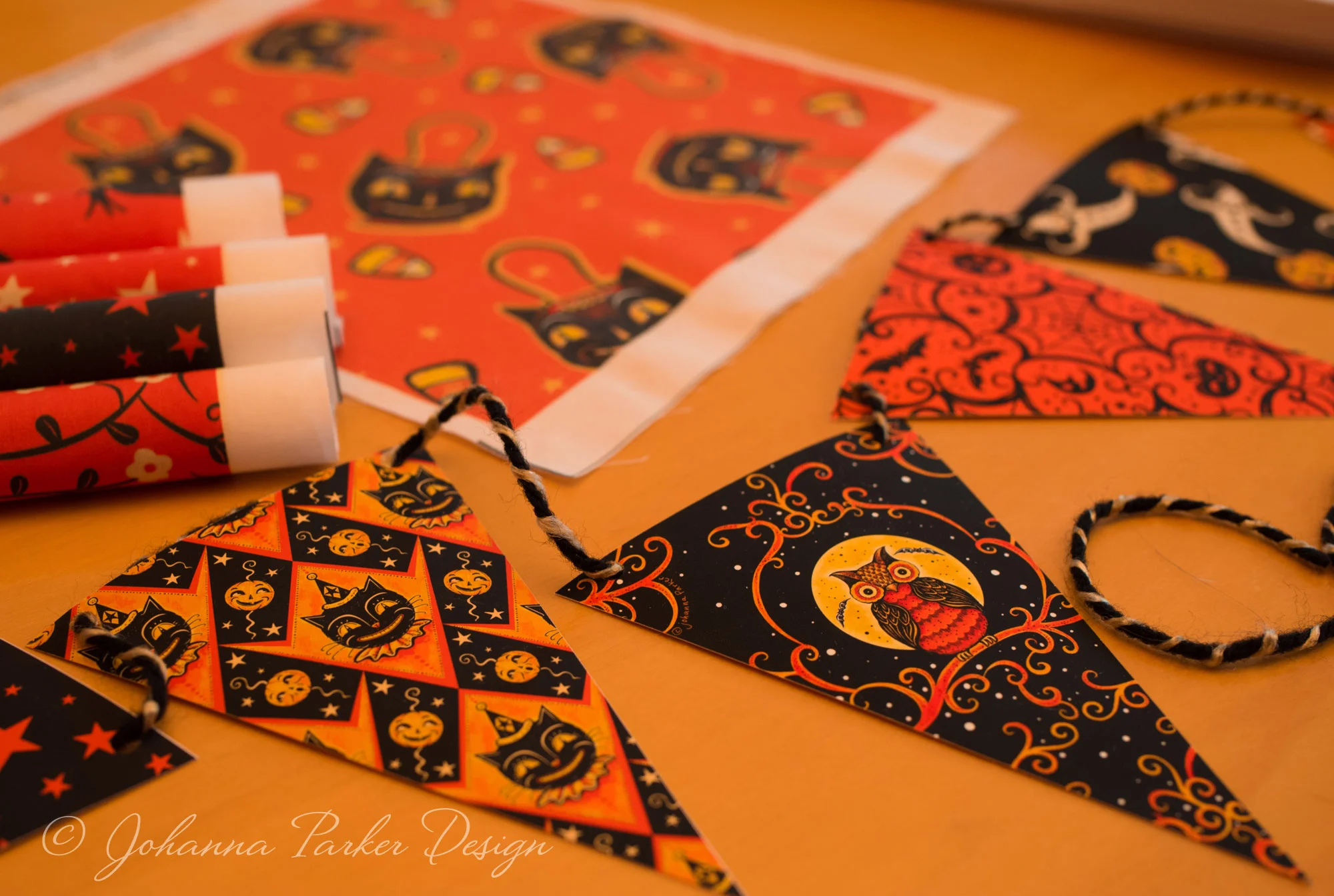 This photo shows a glimpse at one of my Printable Halloween Pennant Garlands. The same pattern work is featured on various designs in my Spoonflower Shop too.