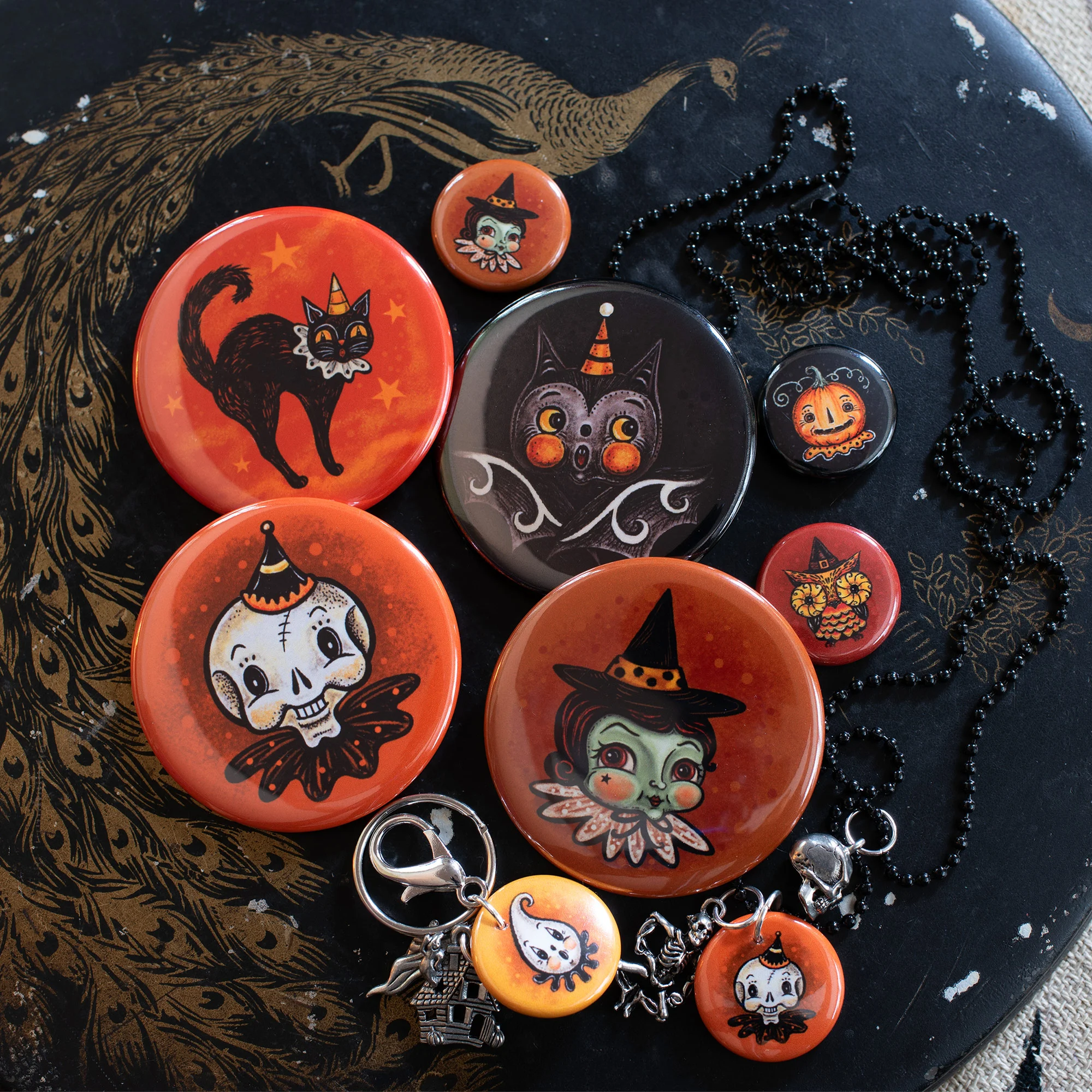 Illustrated Buttons in various size, serve as playful pins, necklaces and key chains…