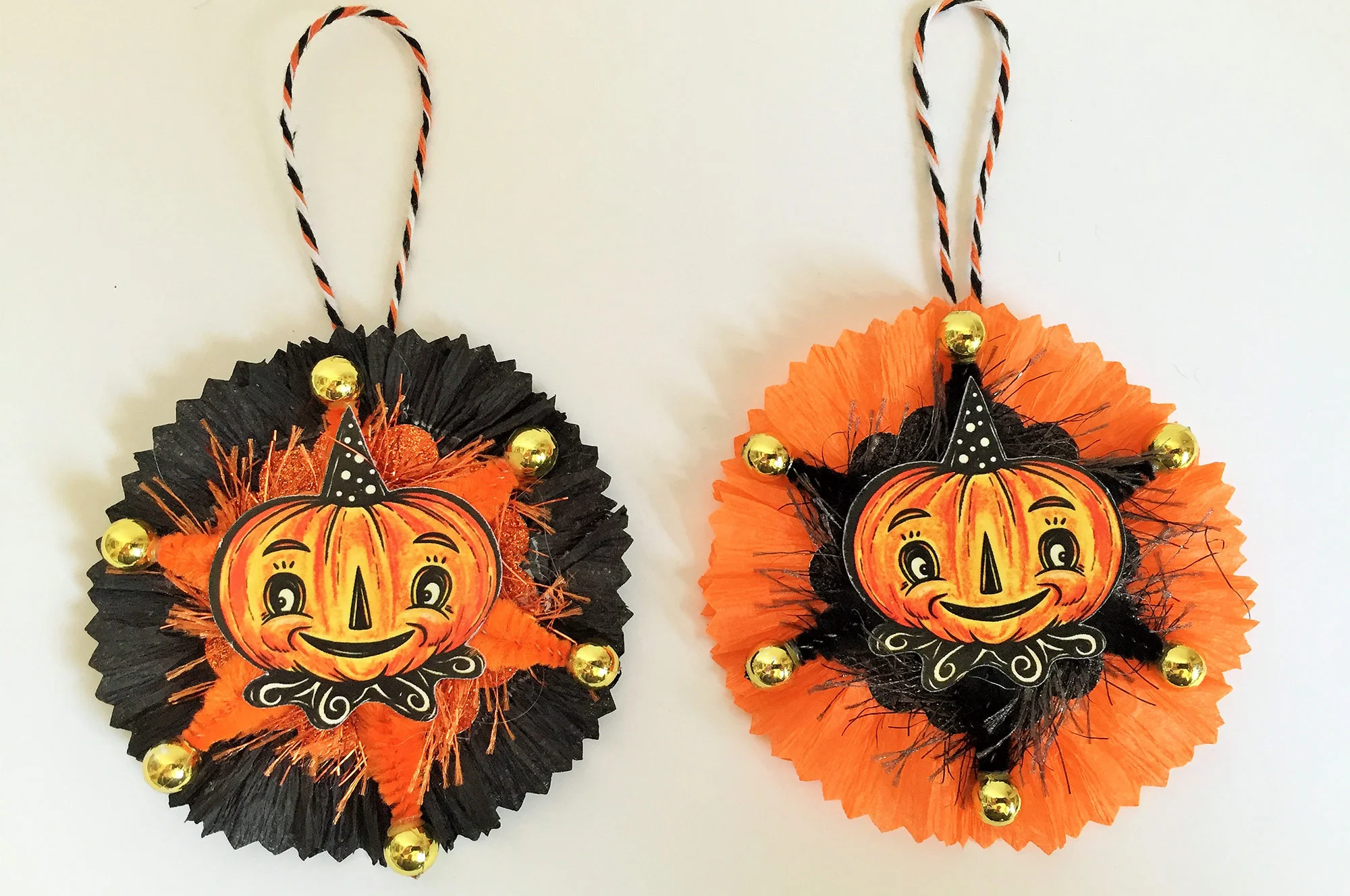 Collect a medley of Pamela’s handmade ornaments, featuring Johanna’s illustrated faces on paper rosettes with chenille accents…