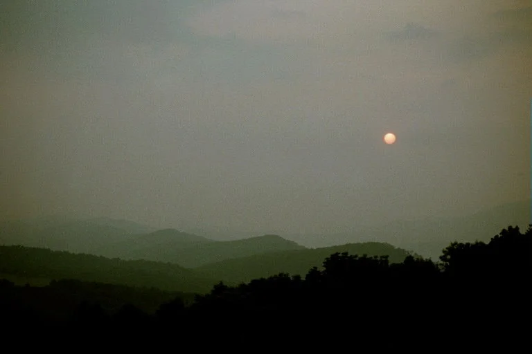 A hazy sunrise from atop Smith Knob of Allegheny Mtn - By Doug Wood