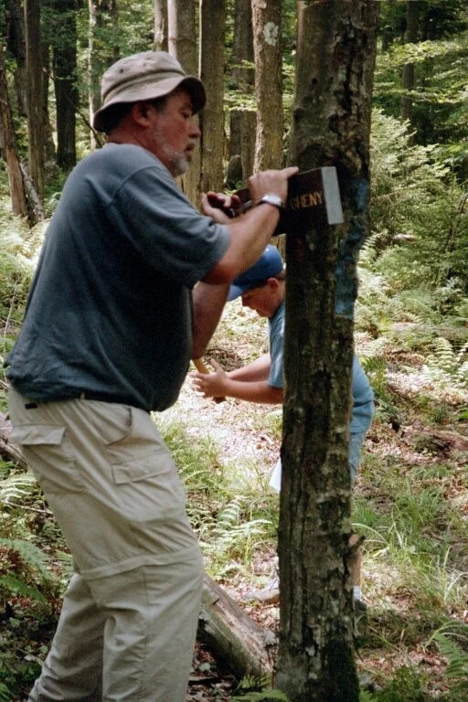Lee Reger & grandson Jacob Kisella erecting Allegheny Trail signs during W5 in 2003. Doug Wood photo.