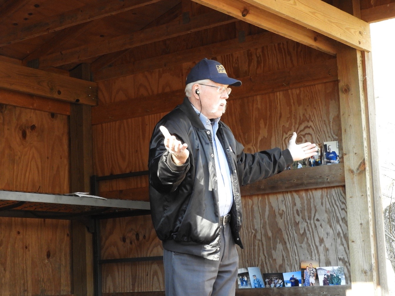 Giles leads participants in a hymn with sign language.