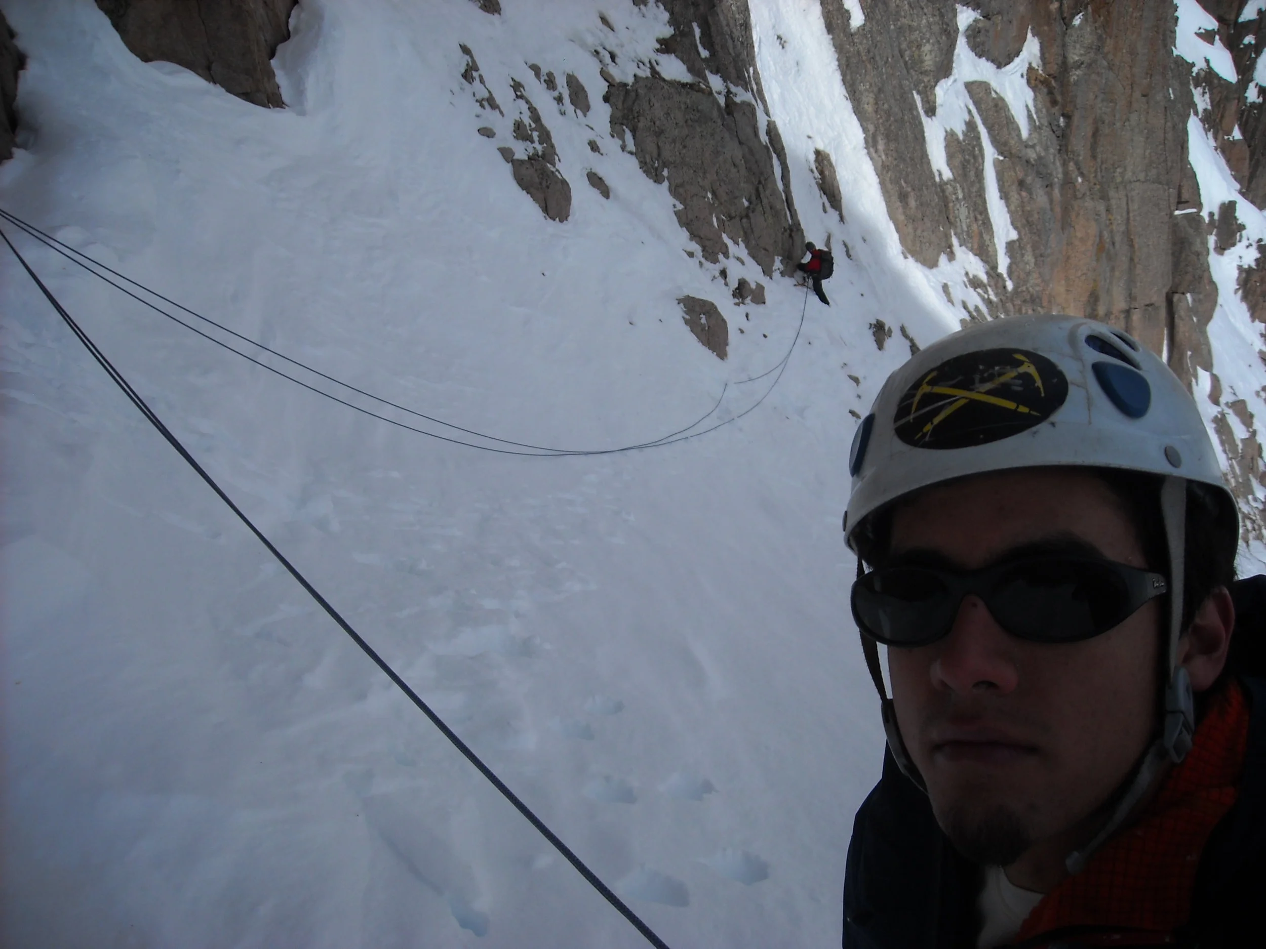 Gil leads a steep snow traverse