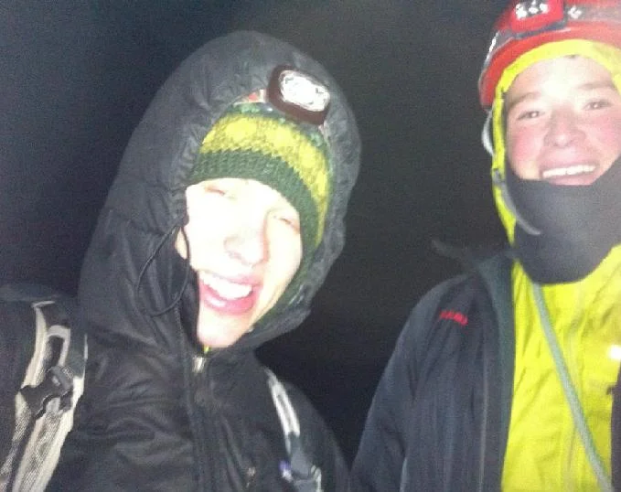 Kirill and Colin on the summit, struggling to stay warm (and grow facial hair)