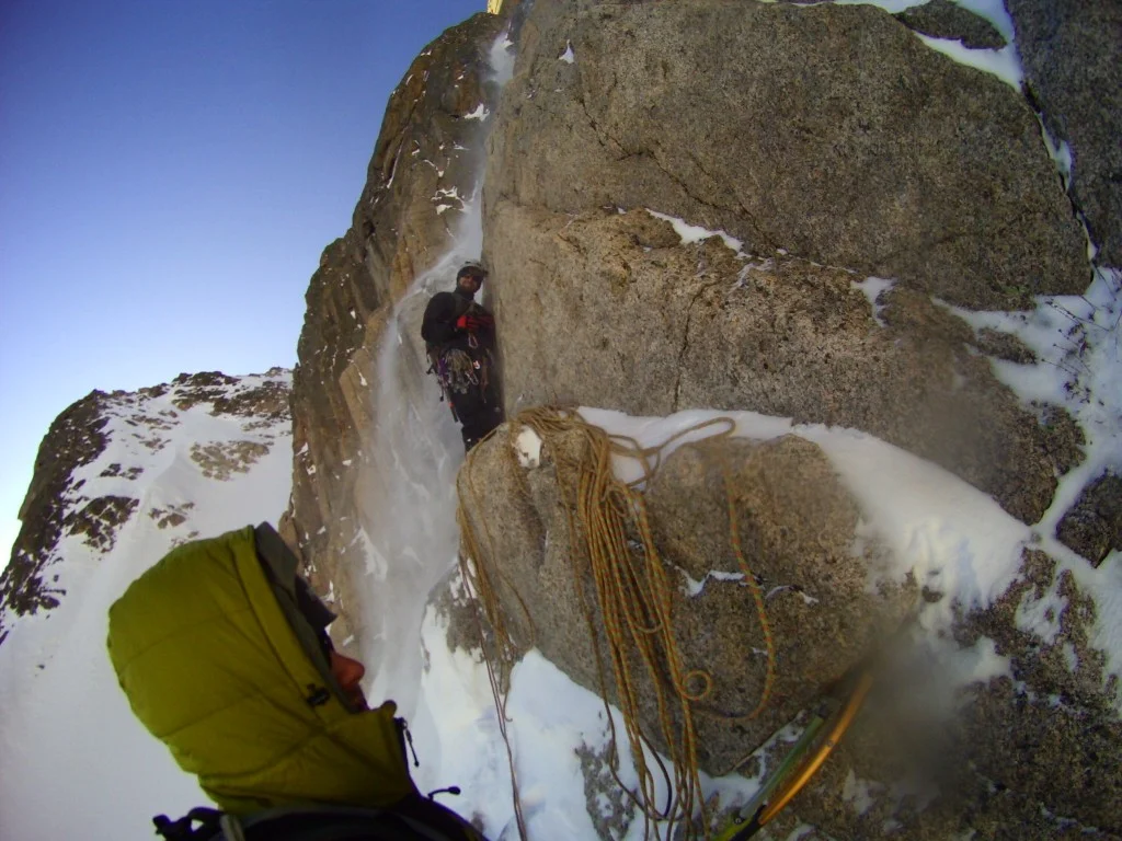 The author at one of his many "homes." East Face of Long's peak during a winter ascent of Alexander's Chimney