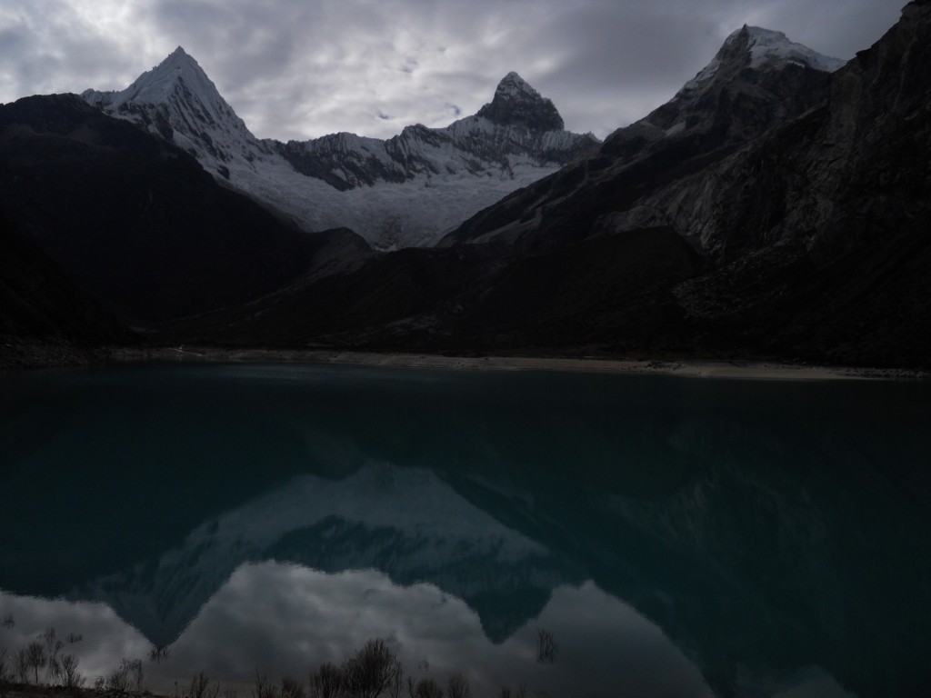 Piramide on the left, and Chacraraju Oeste on the right, reflected in Laguna Paron