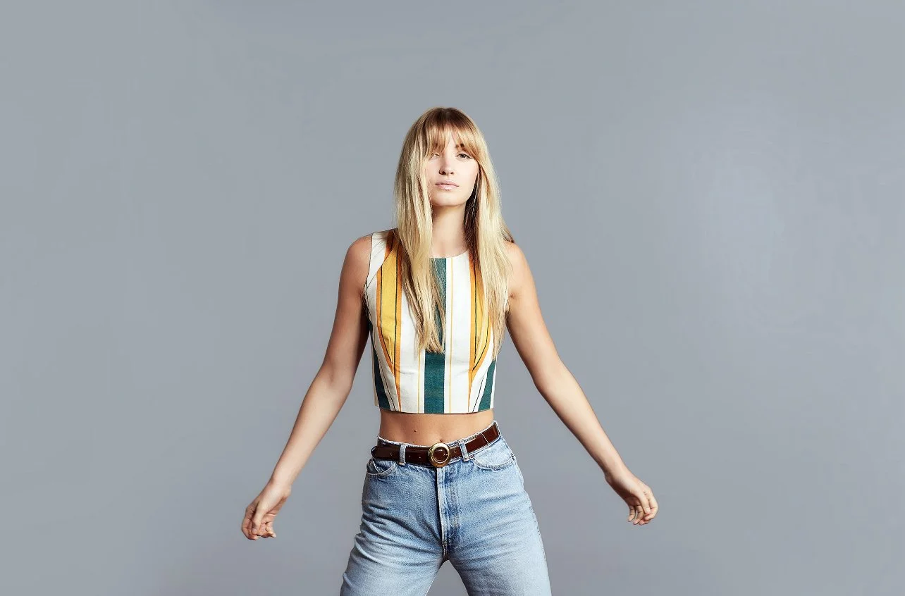 Woman with beautiful blonde hair colouring from south yarra hair salon