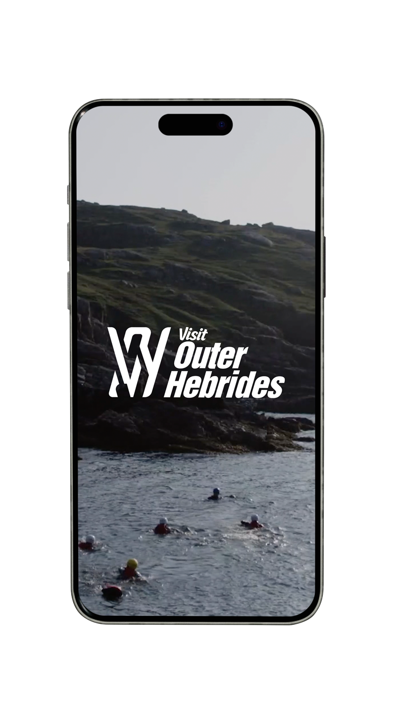 Smartphone displaying a promotional image for Outer Hebrides with a scenic view of the sea, rocky hills, and swimmers in the water.