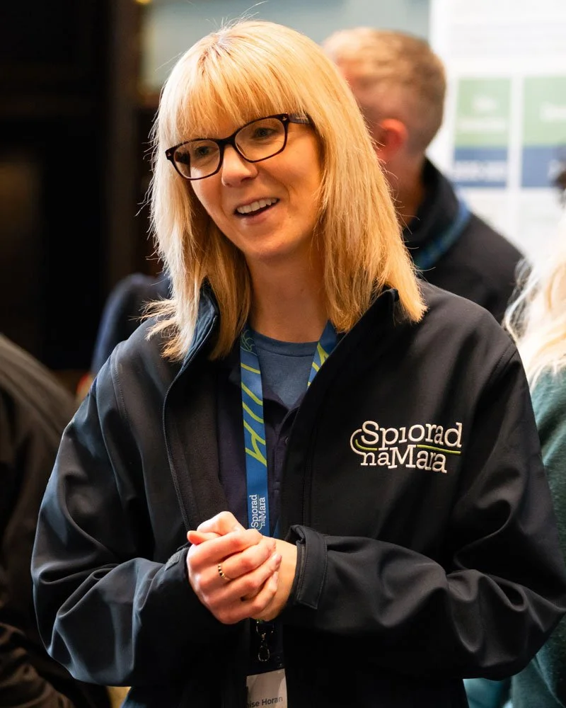 A renewable energy worker in Spiorad Na Mara branded workwear.
